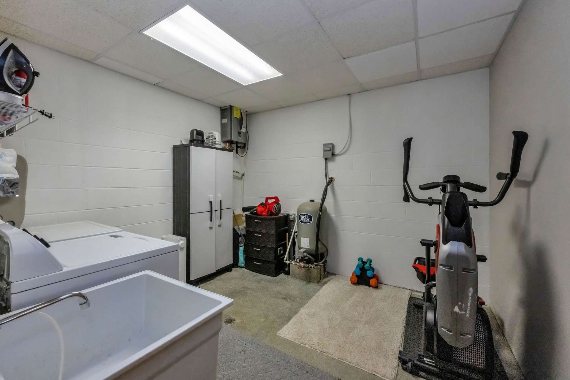 The spacious lower-level laundry rooms creates space for working out...if you're into that!