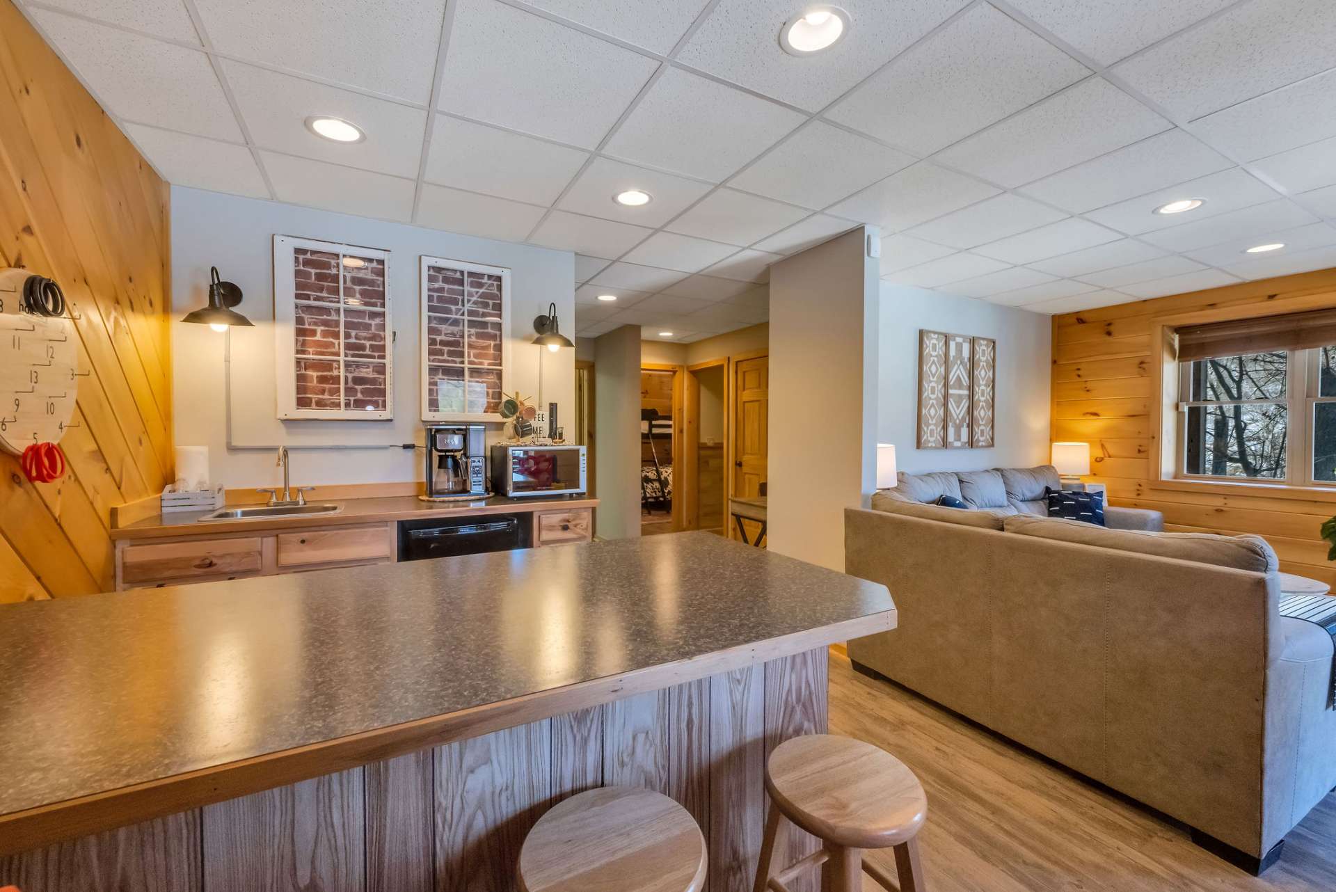 A bar with a kitchenette for serving up drinks or snacks.