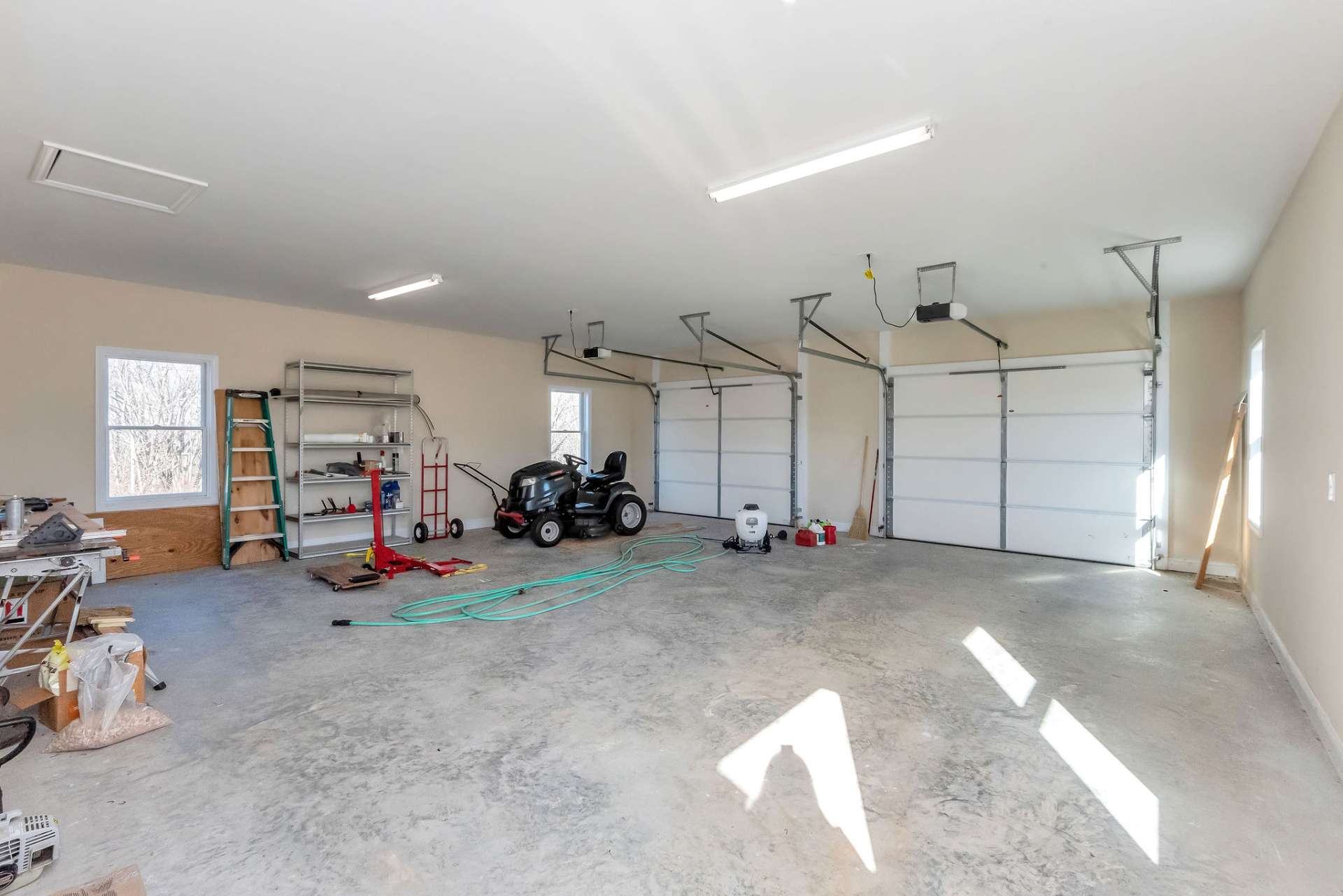 Outside, the oversized two-car detached garage is connected to the home by a breezeway and features additional space for tools or a workshop.