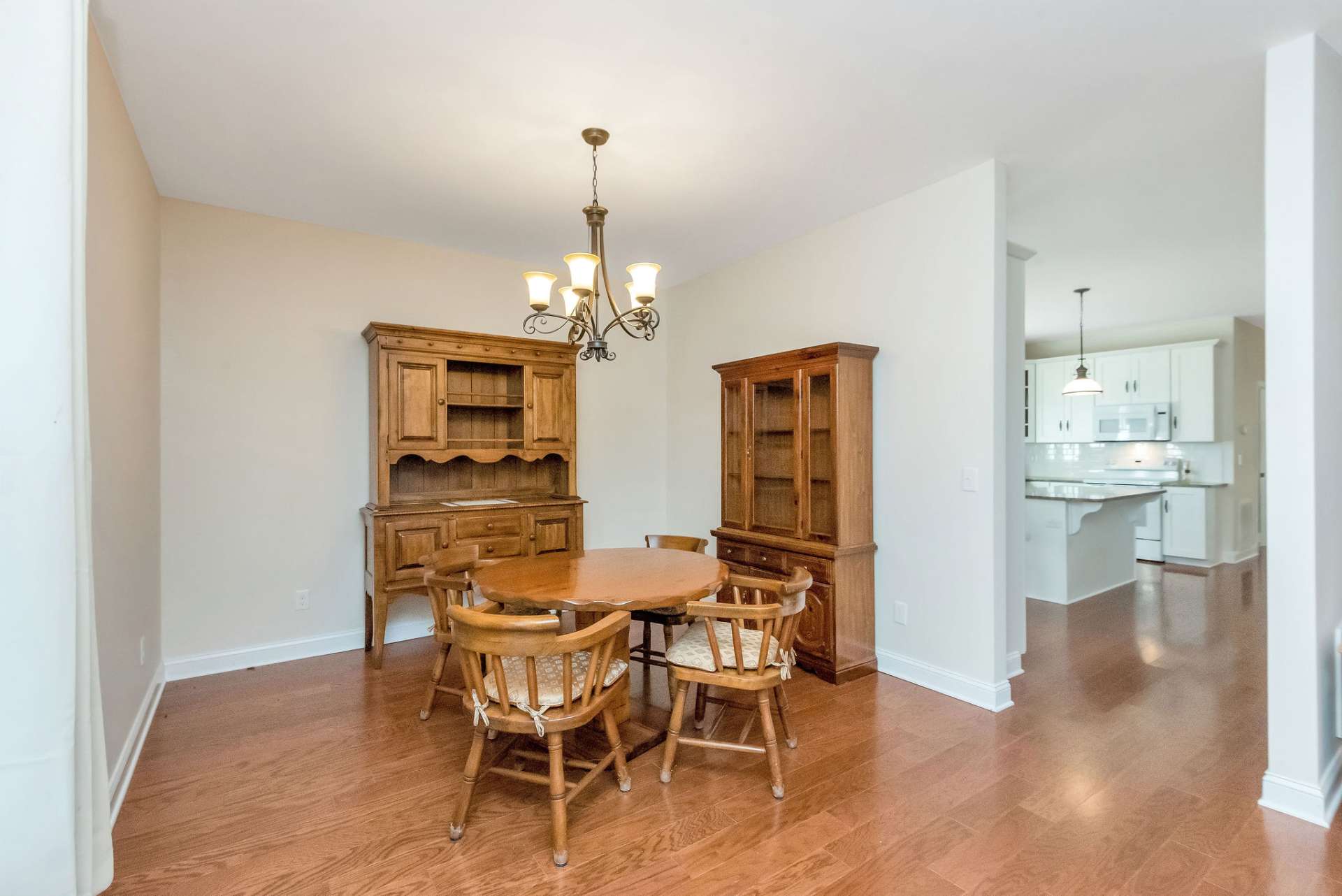 The dining area is conveniently located just off the kitchen and flows effortlessly into the living room, creating a harmonious open-concept space that’s perfect for entertaining or everyday living.