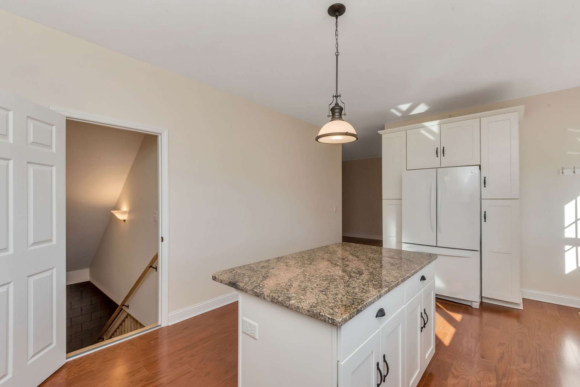 Door to the lower level is located in the kitchen.