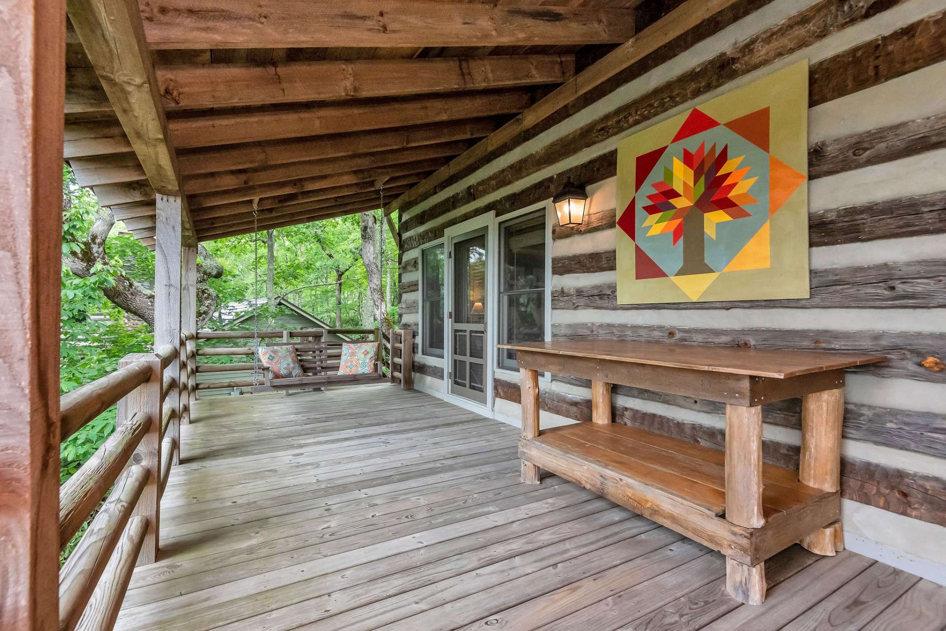 The wrap-around covered porches and expansive outdoor living room make this cabin an entertainer's dream.