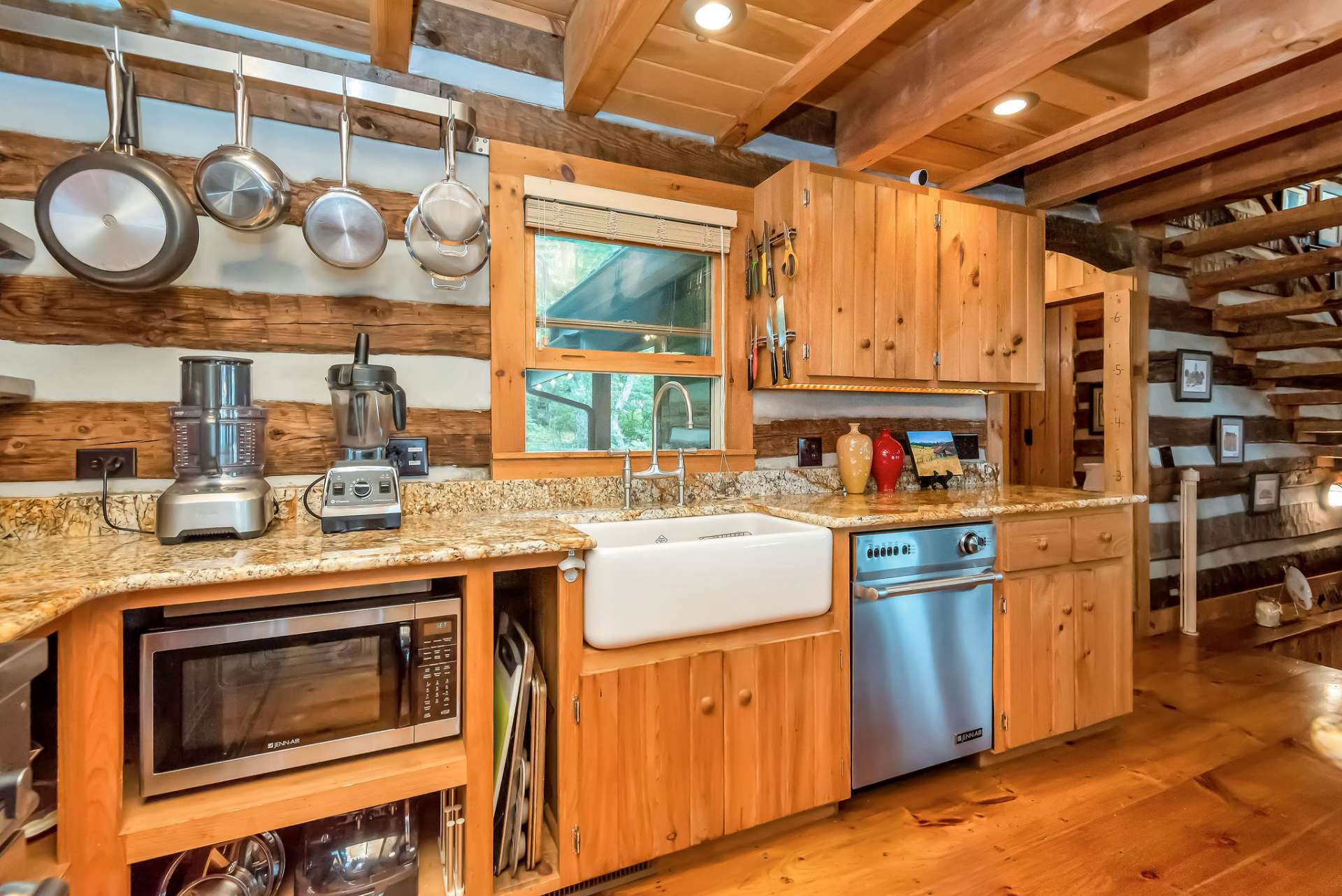 This European farm sink adds a unique accent to the kitchen's rustic yet modern feel.