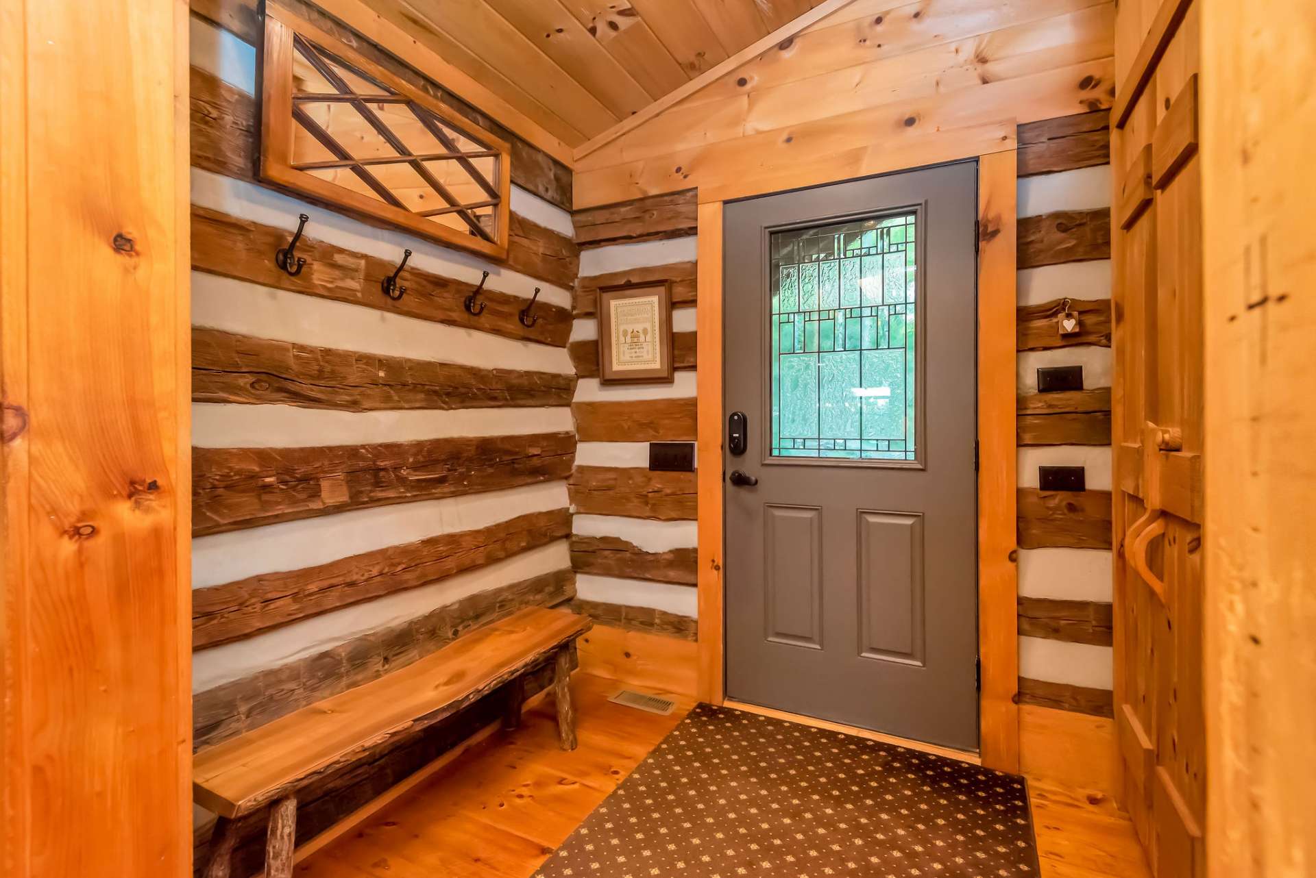 Welcome to your mountain getaway! Entryway with coat closet and room to take off your hiking shoes.