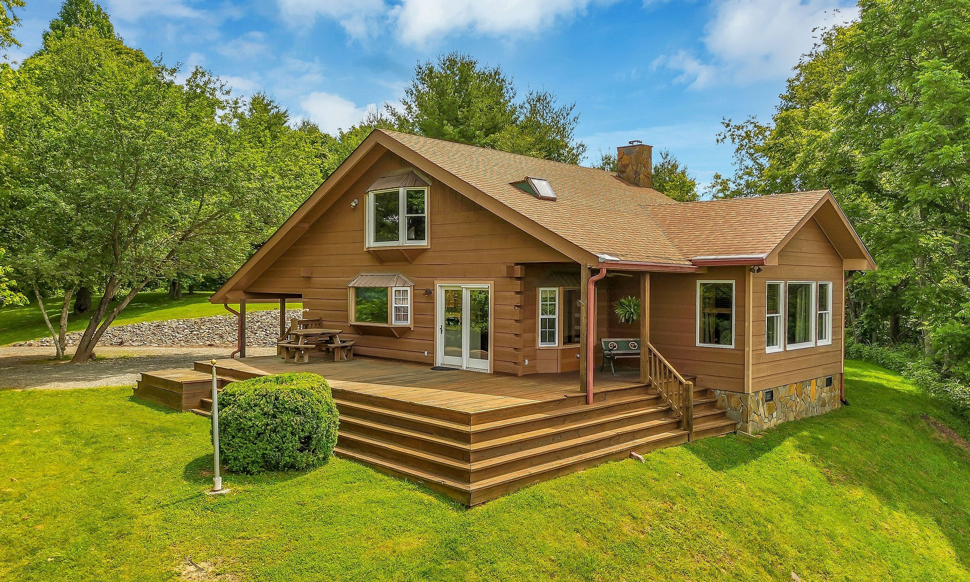 Welcome to 127 Sanctuary Drive, an enchanting log cabin set on 7.125 acres in a park-like setting with complete privacy.