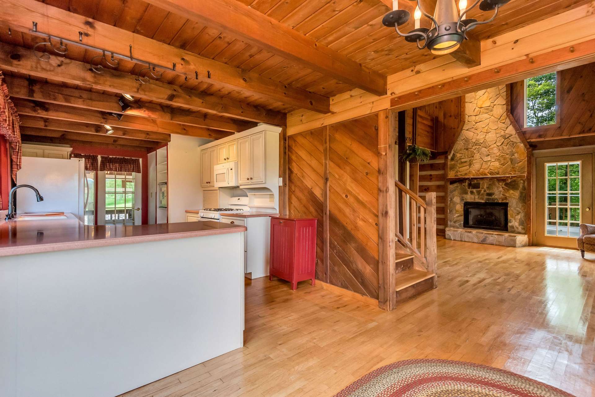 The kitchen, dining area, and living room flow seamlessly together, creating a cohesive and inviting space for everyday living and entertaining.