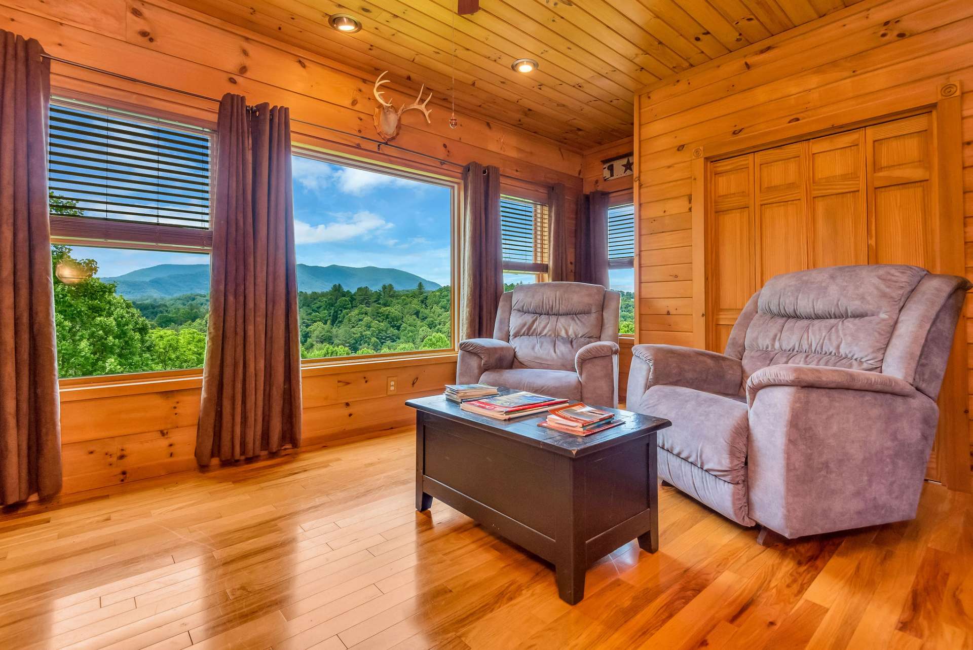 The small and cozy den adjacent to the living room is wired for surround sound, offering a perfect retreat for relaxation or entertainment.