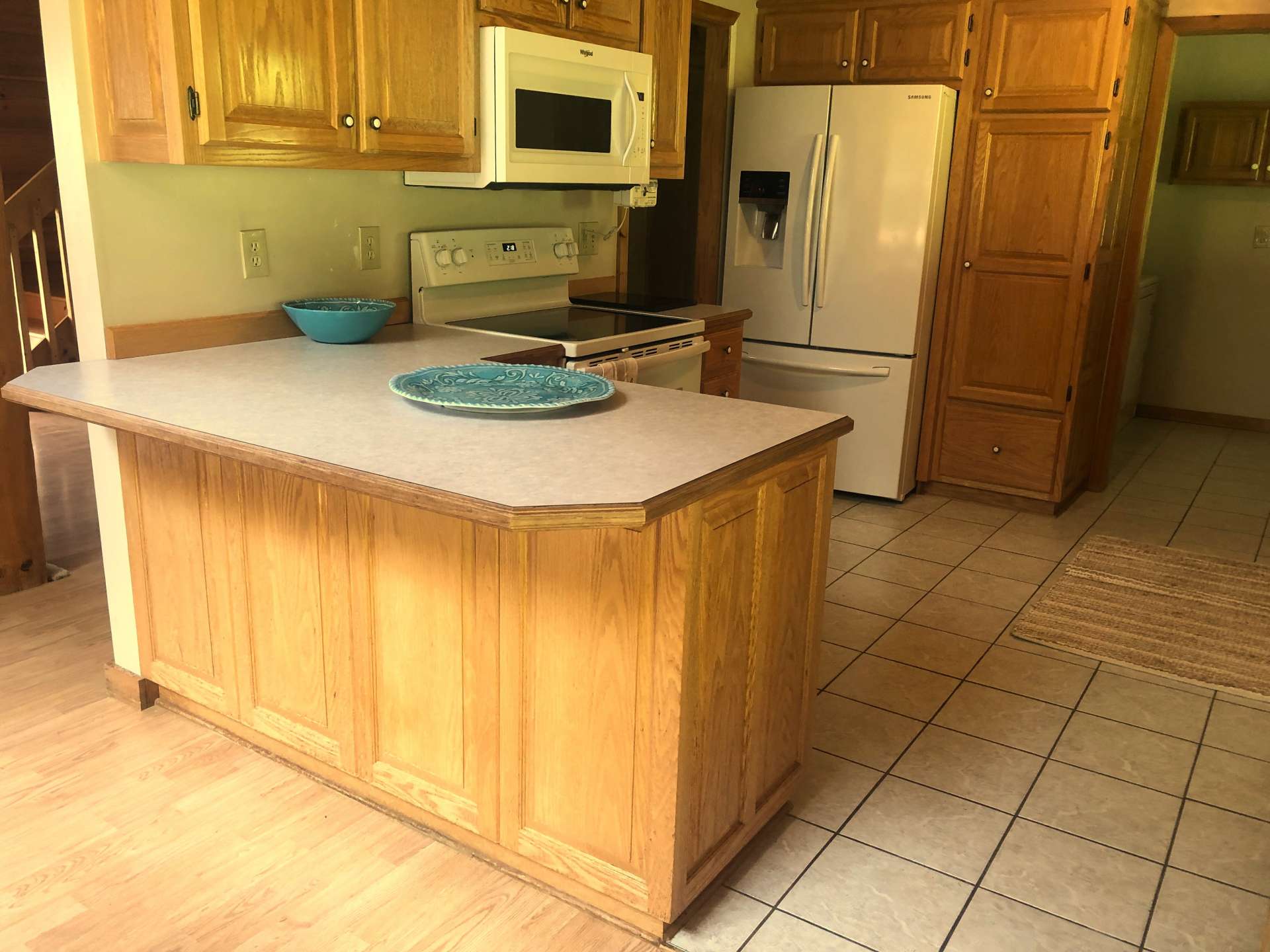 Bar seating with kitchen open to the dining room