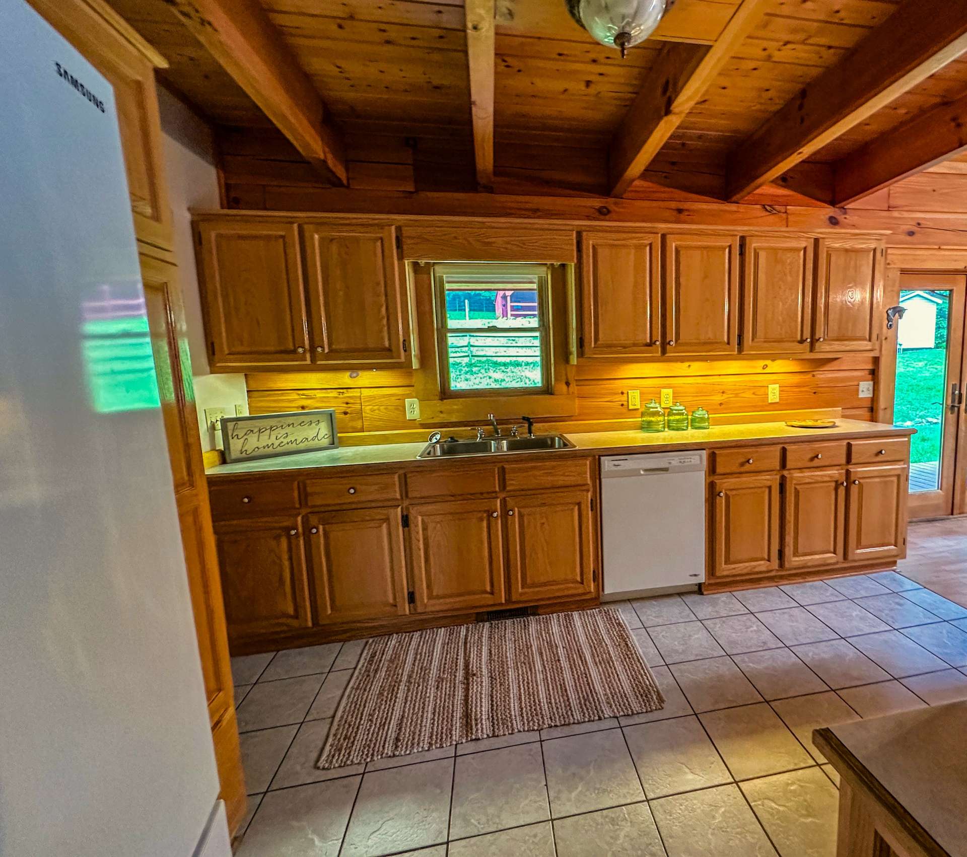 A glance into the kitchen as you step down the hallway to the bathrooms and 2 main level bedrooms