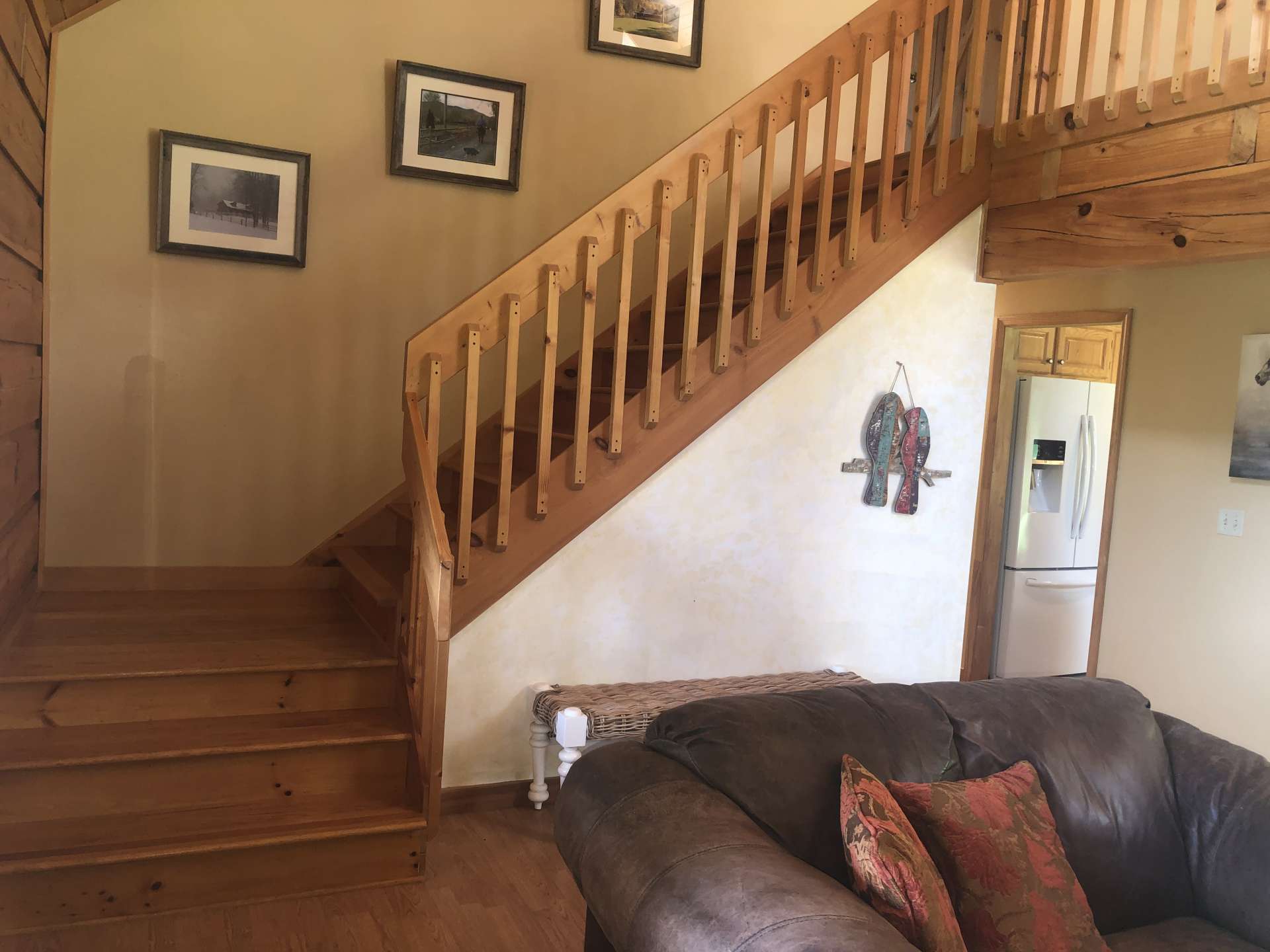 Oak stairs with open rail to the loft area