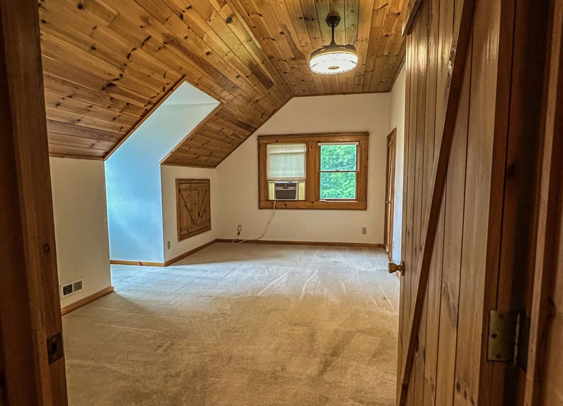 Upstairs primary bedroom has plenty of space for a a king bed