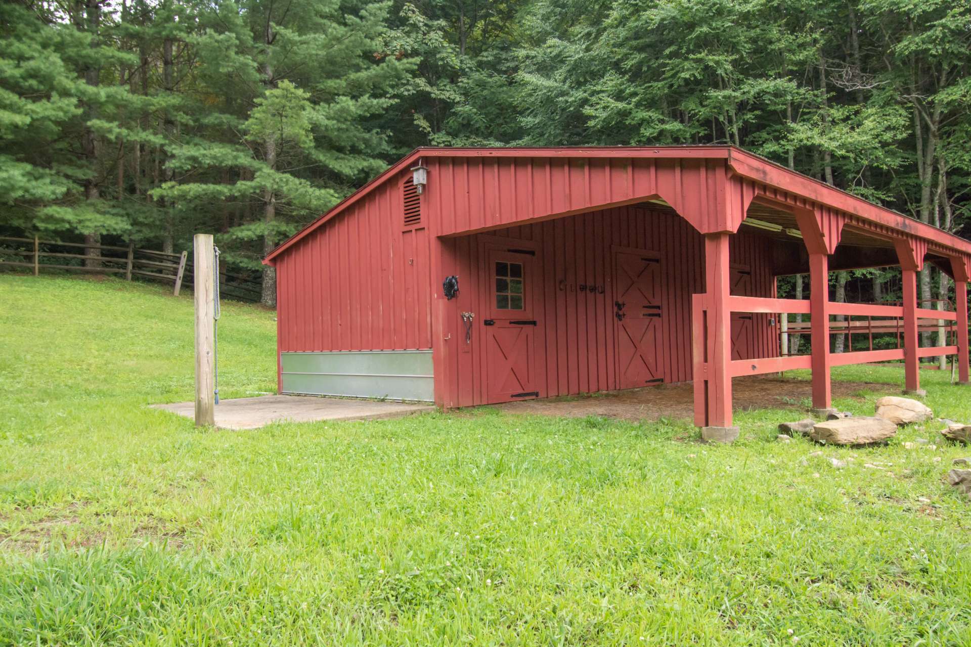 Barn with 2 stalls, wash pit, tack room, and RV hookup