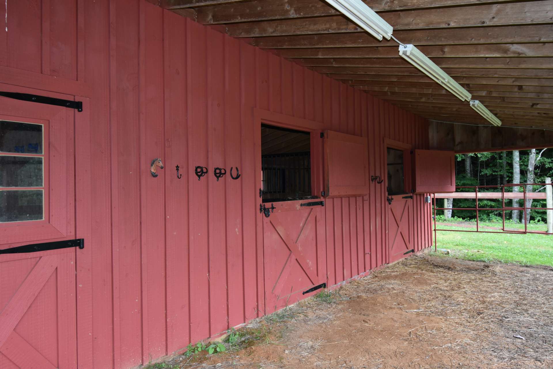 Barn features 2 stalls and a nice tack room with hot and cold water