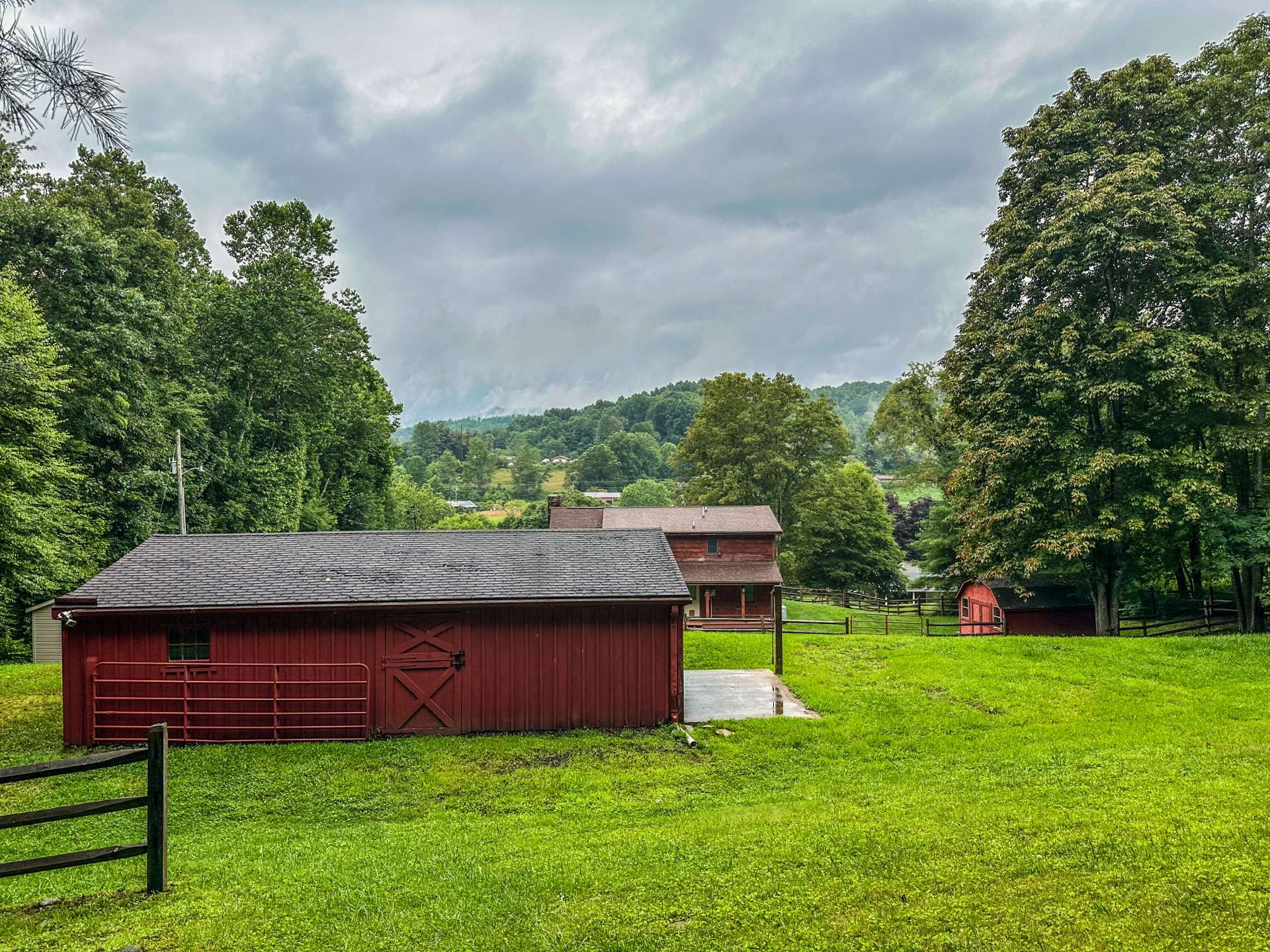 View of the back side of the barn which has a walk through stall for your convenience