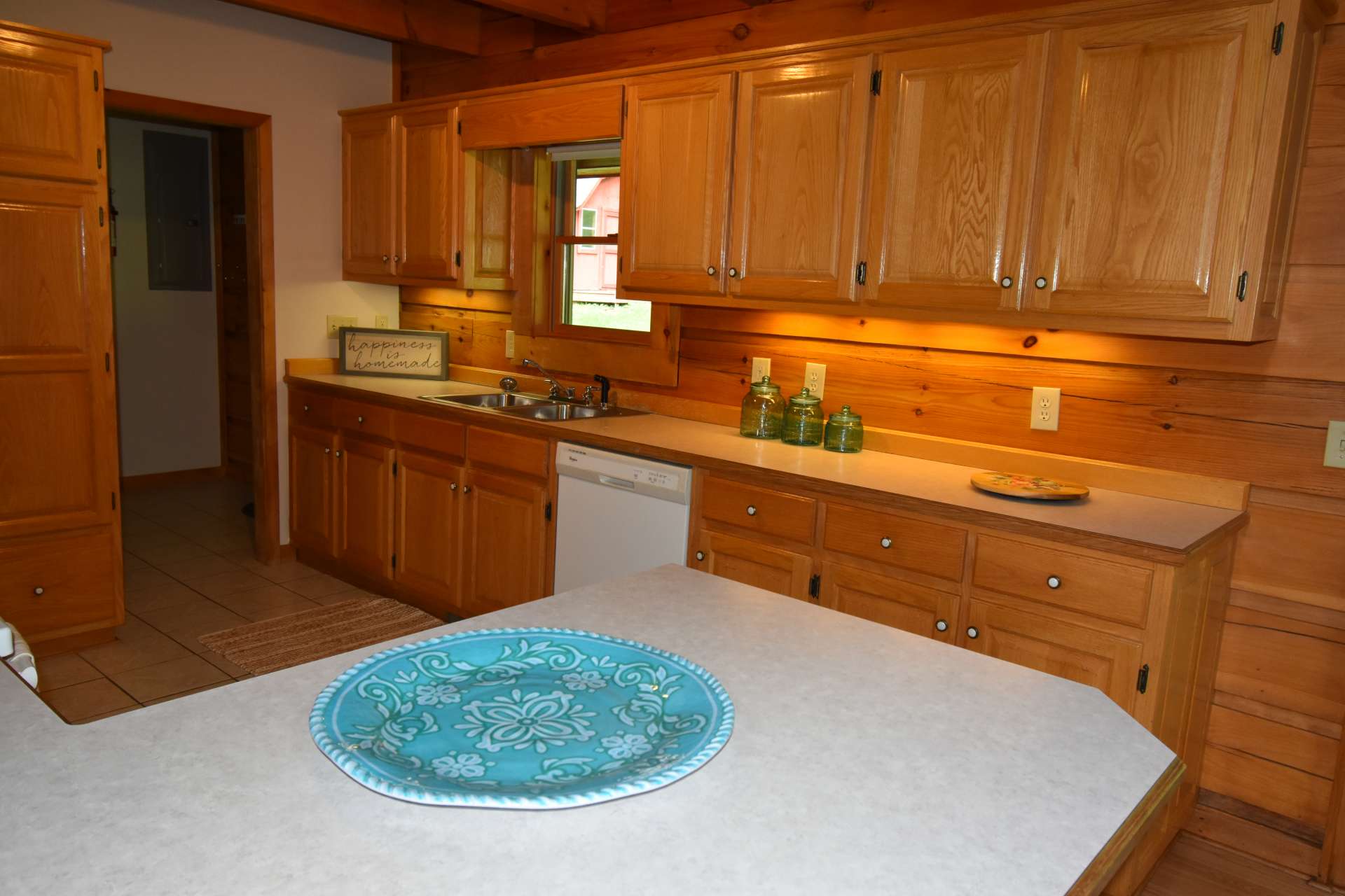 Oak Cabinets with a laundry room off the kitchen