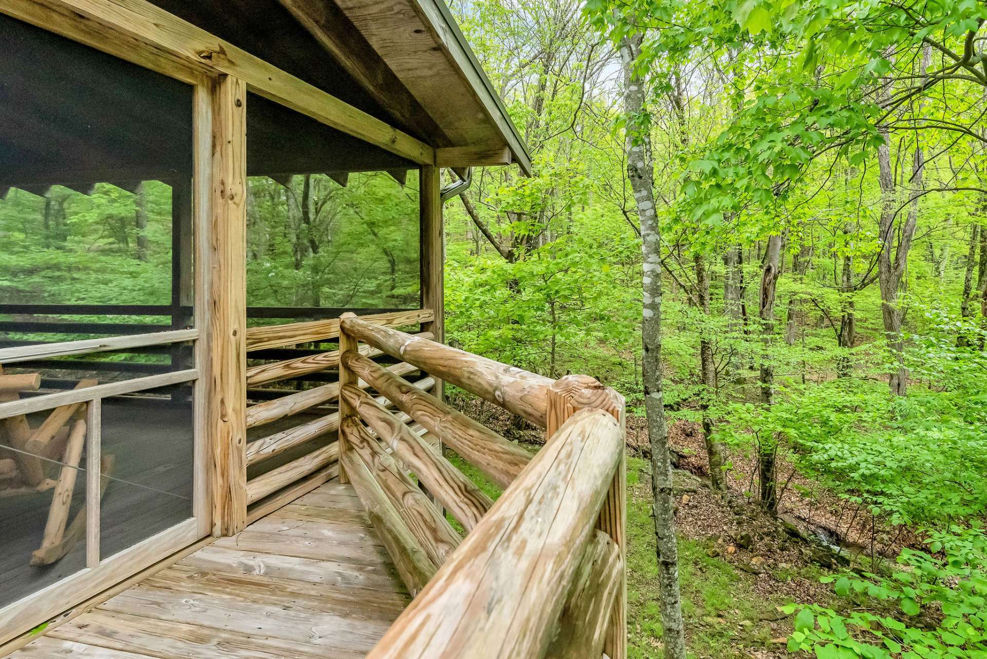 back screened porch where you can savor early mornings listening to the birds or unwind in the late evenings to the soothing sounds of crickets.