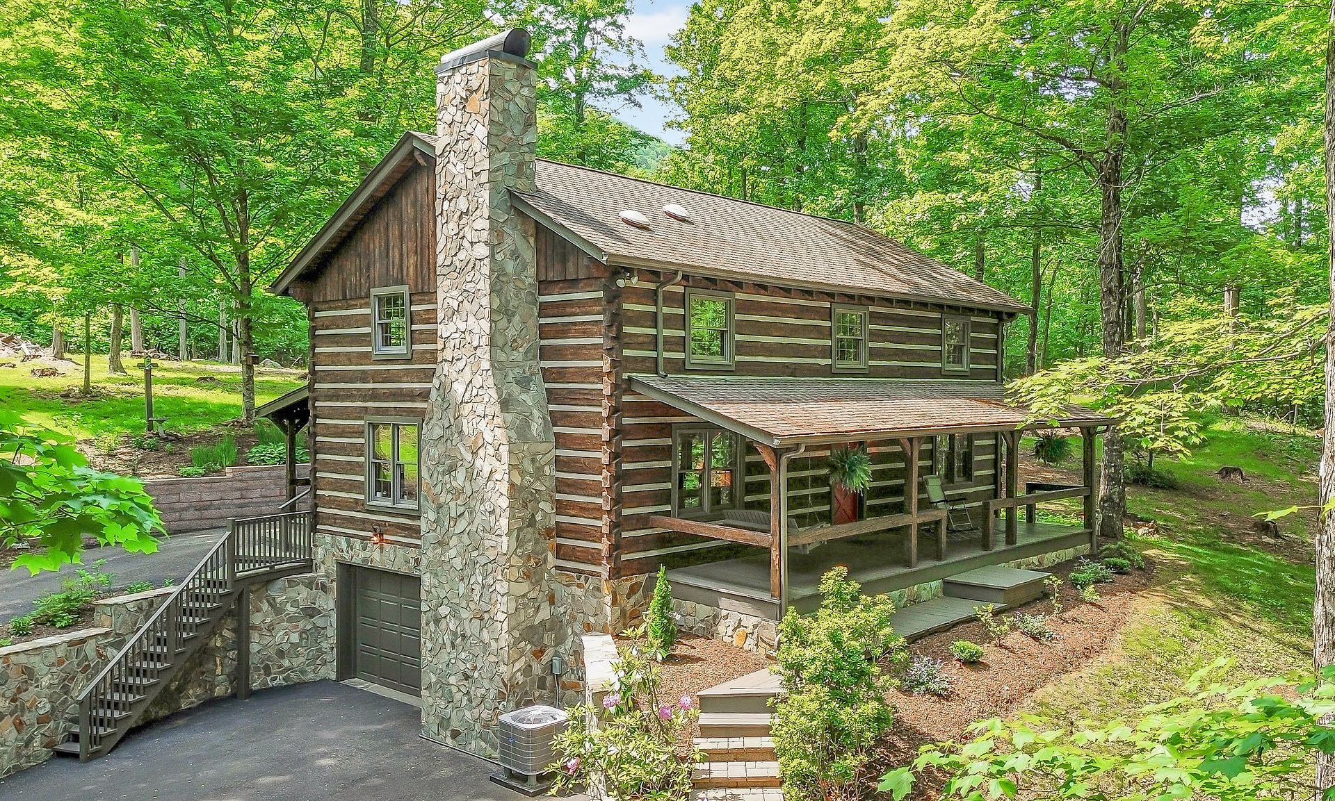 Nestled in the picturesque landscape of desirable West Jefferson, this extraordinary log cabin and expansive 36-acre property offer a truly unique opportunity.