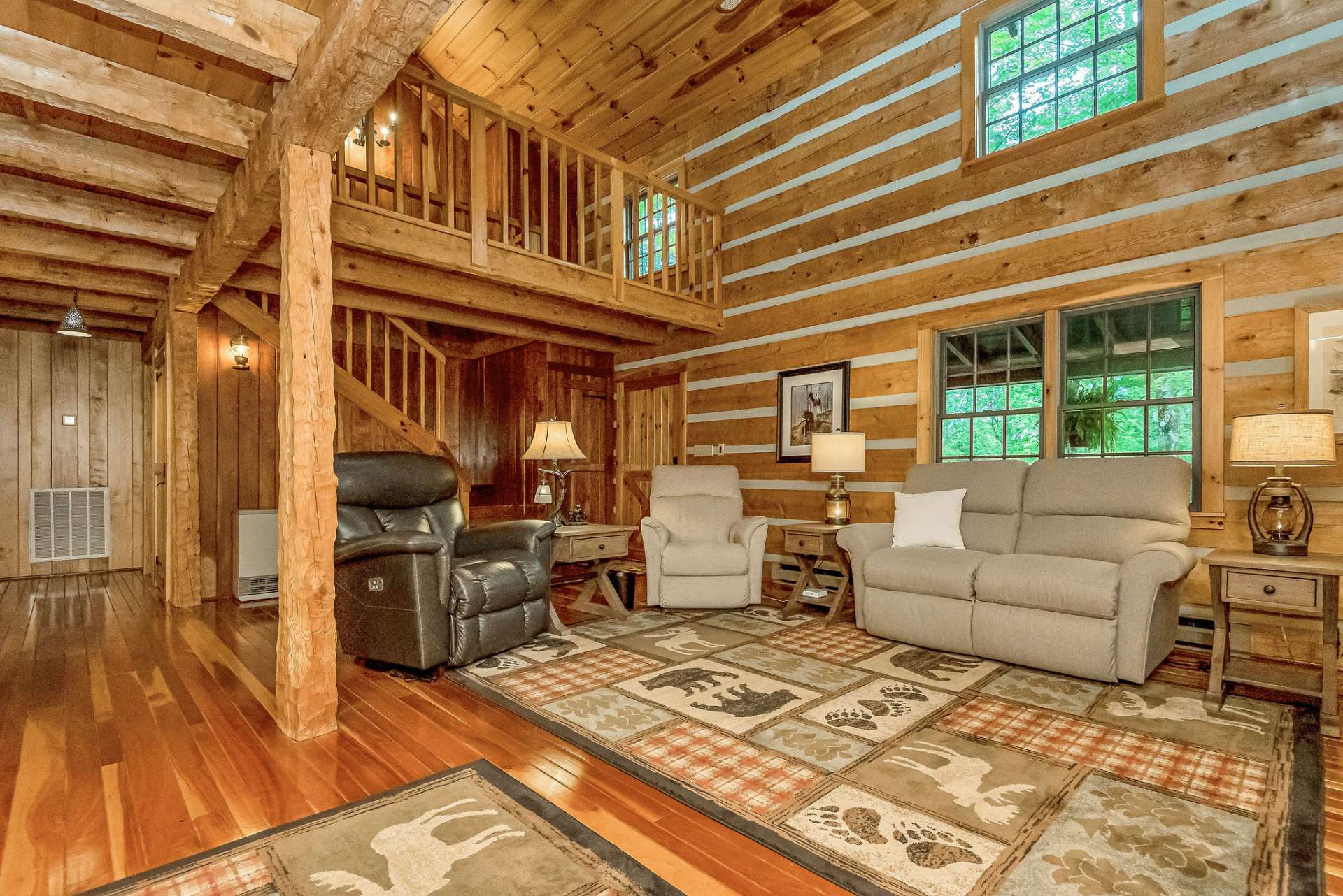 Inside, the cabin exudes warmth and charm with its stunning cherry flooring, complemented by cherry tongue-and-groove walls, solid cherry and maple interior doors, and exposed beams.