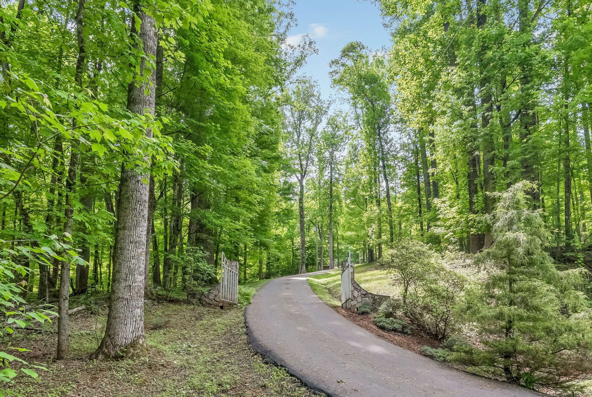 A gated private paved driveway leads to the cabin, ensuring both privacy and easy access. Enjoy the serene surroundings and the added security of a gated entrance as you arrive at your secluded retreat.