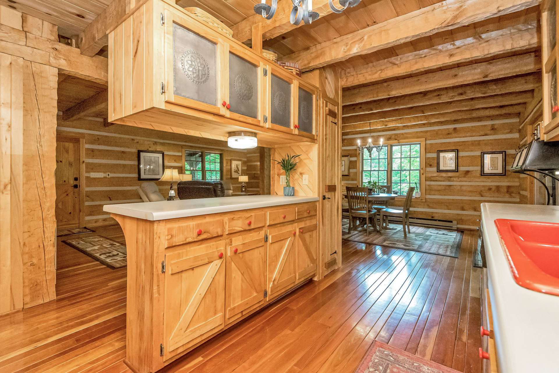 This section of cabinetry not only offers additional storage space but also provides some separation from the living area, creating a distinct yet open feel in the kitchen.