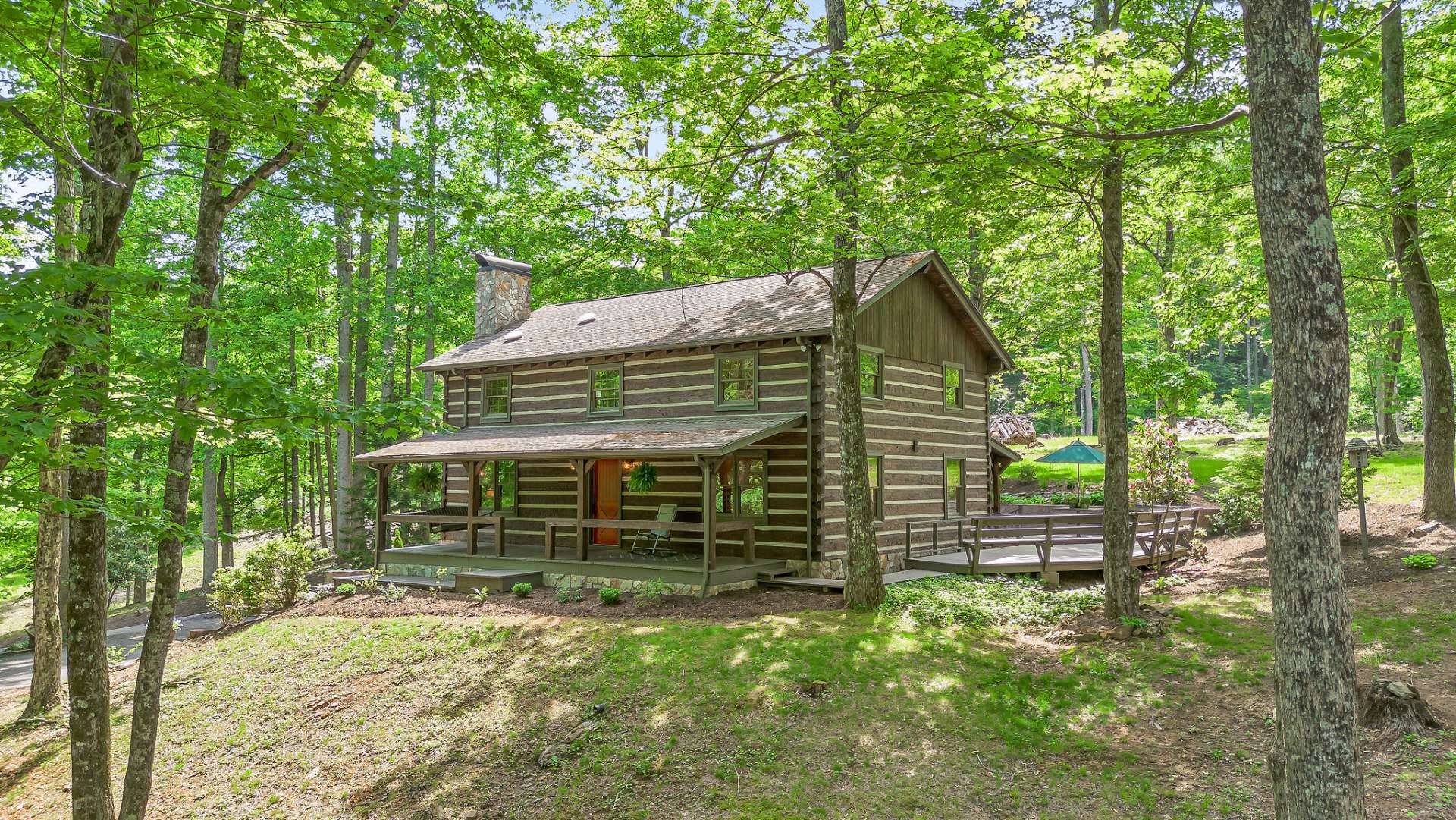 Crafted with meticulous care, the log cabin itself is a testament to artisanal craftsmanship. Each hemlock log was hand-cut and hewed by the previous owner, who also sourced stone from the property to fashion the majestic fireplace and chimney....