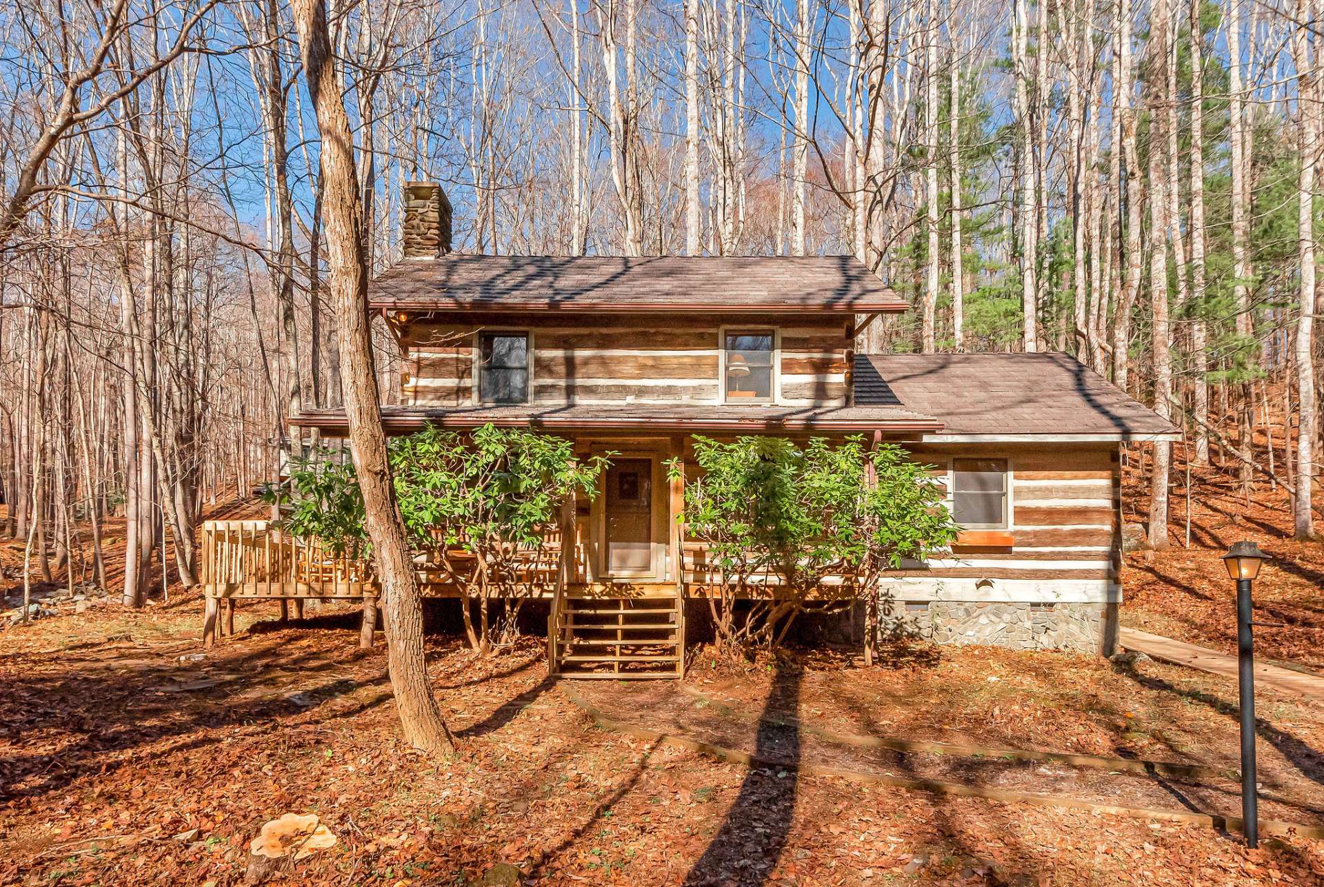 Nestled within the peaceful enclave of Stonebridge, this antique log cabin is surrounded by nature's splendor.