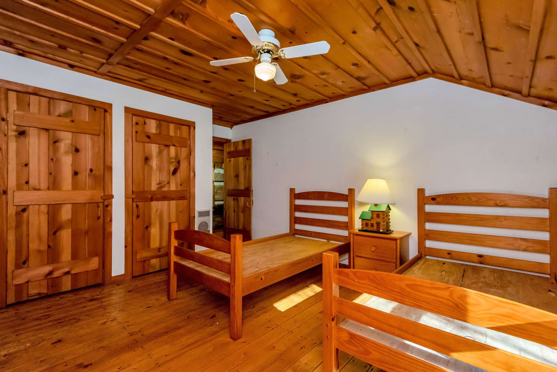 The vaulted ceiling adds to the spaciousness of this room.