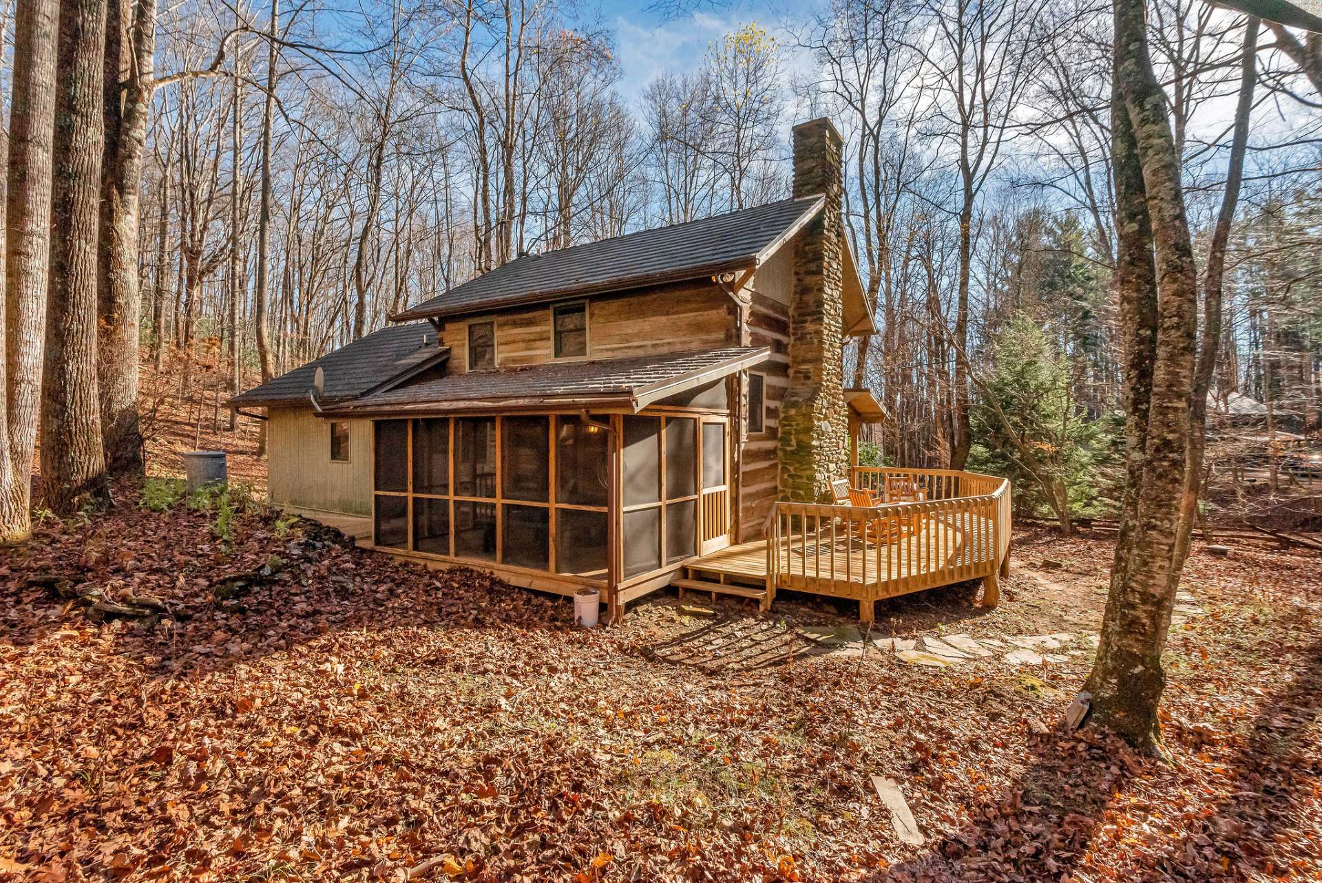 The screened back porch offers a cozy, all-weather oasis where you can unwind to the sounds of the creek.