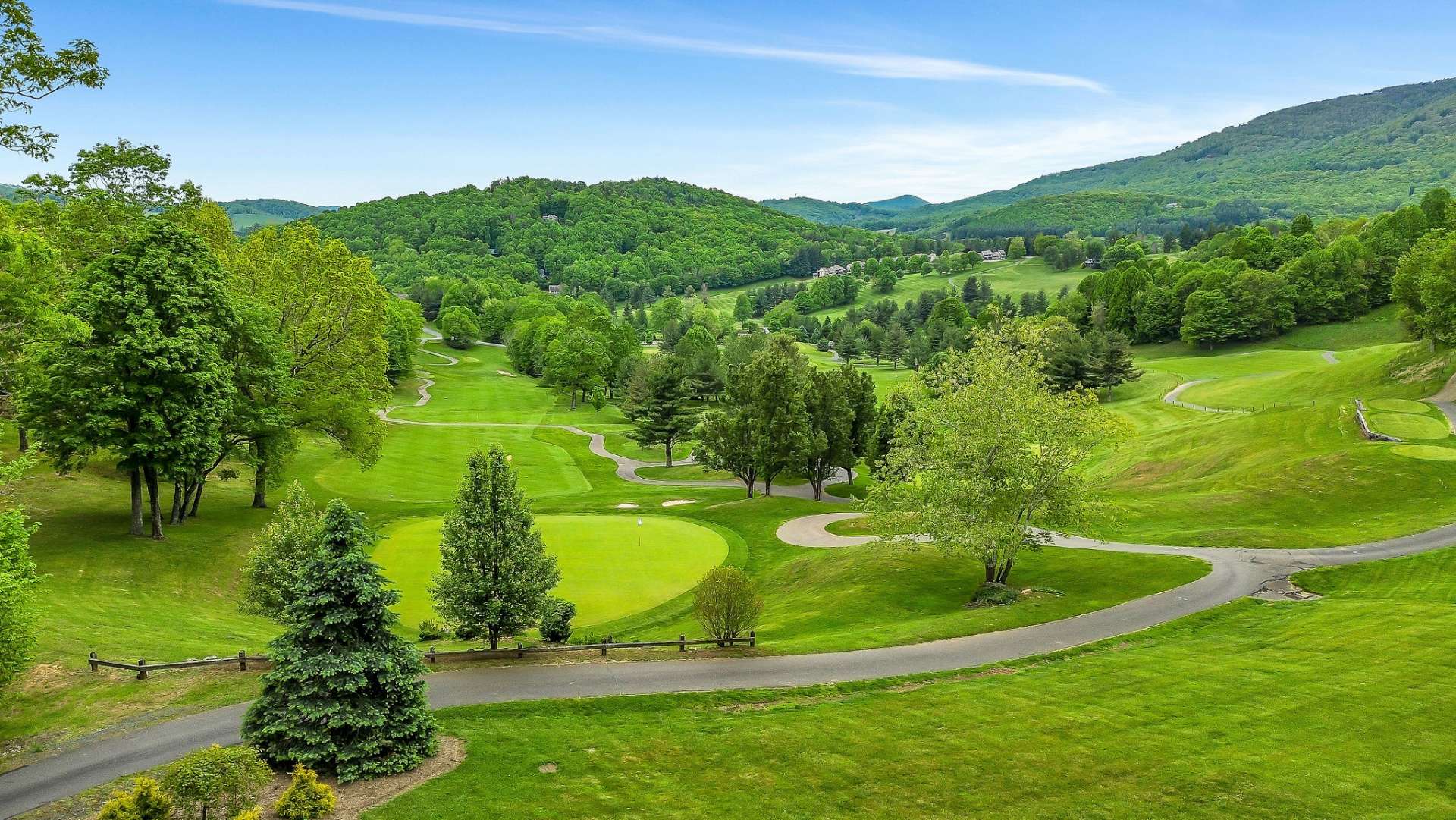 Boasting unparalleled views of Fairway #5 and the majestic mountains beyond.