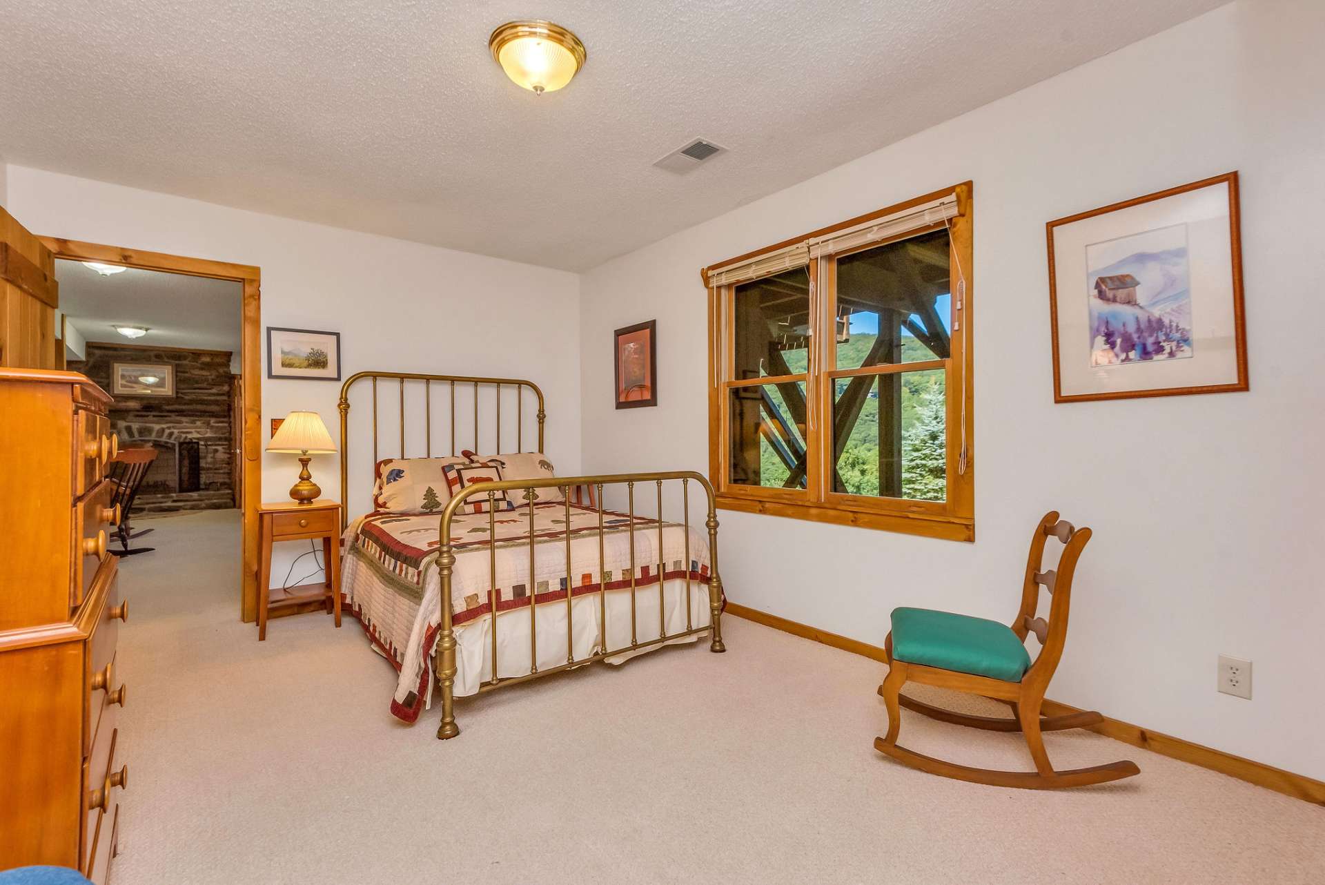 The lower-level guest bedroom offers comfort & convenience for guests or family members alike.