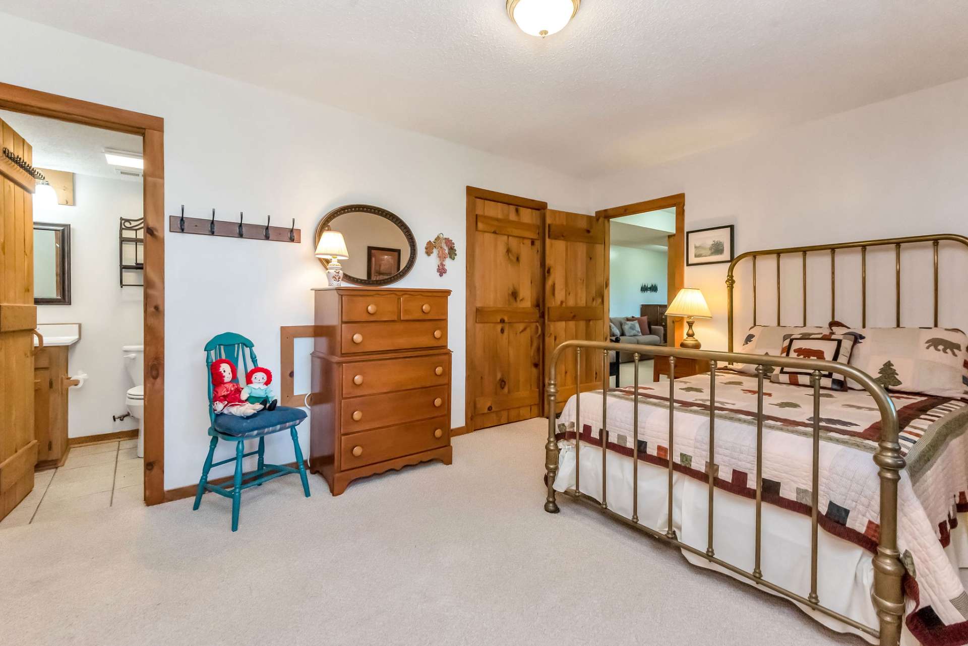 This well-appointed bedroom with a full bath and convenient laundry facilities round out the lower level.