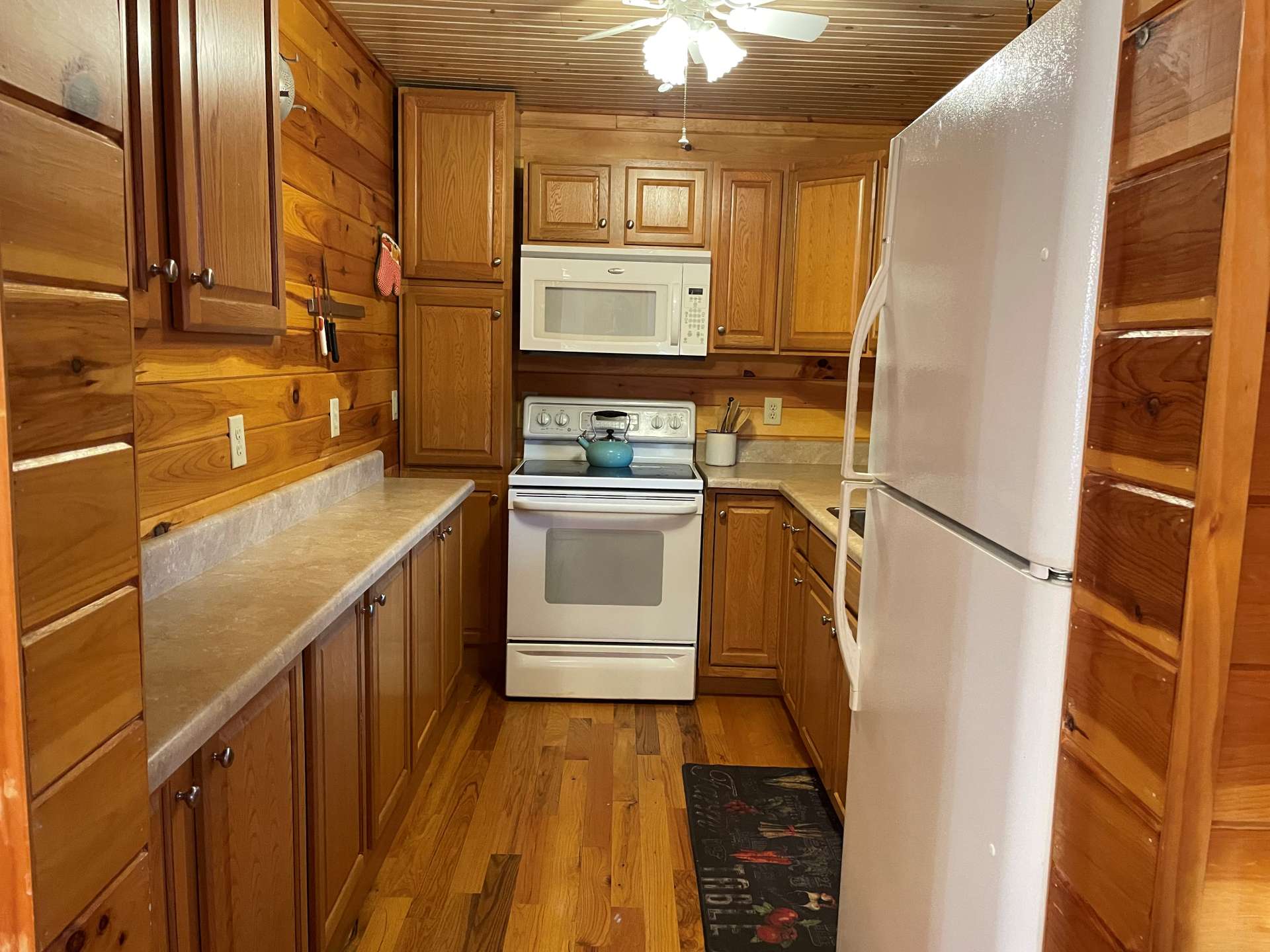 The kitchen has plenty of countertops and includes all appliances.