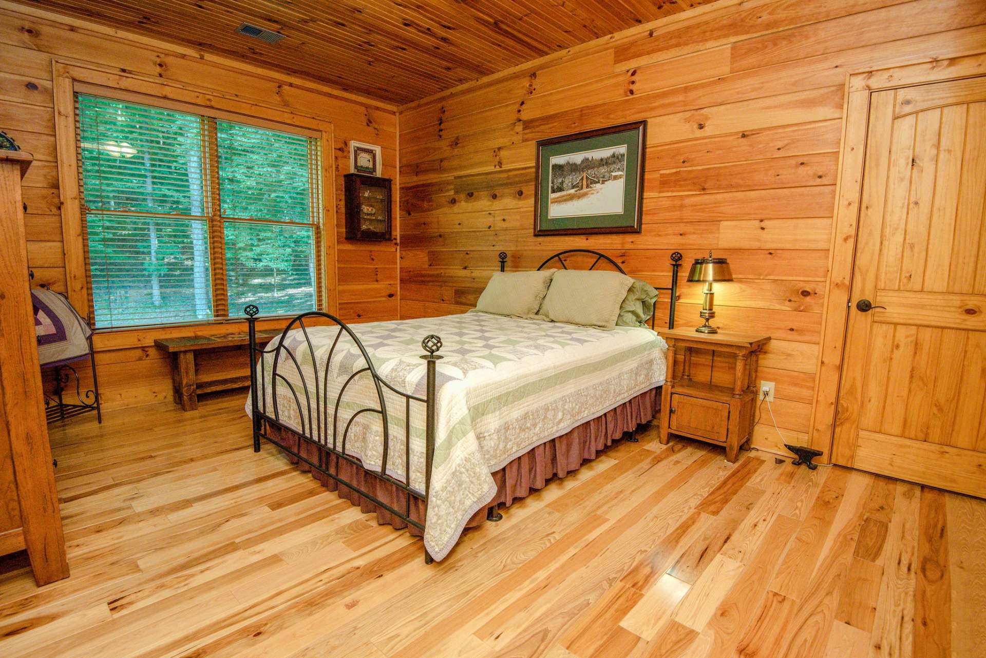 Additional guest bedroom featuring custom storage.