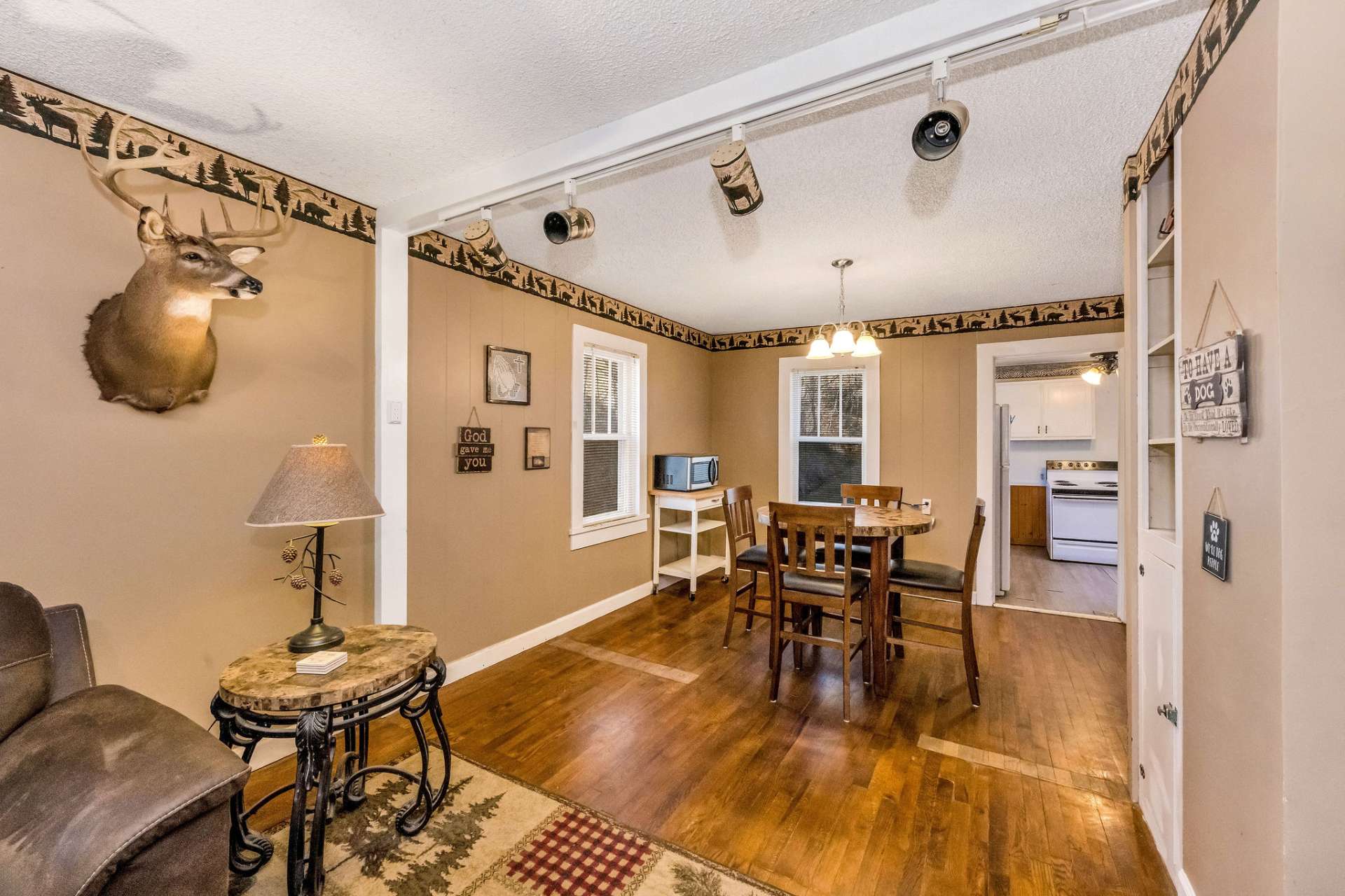 An inviting open-concept living and dining area, designed to maximize space, natural light, and seamless flow.