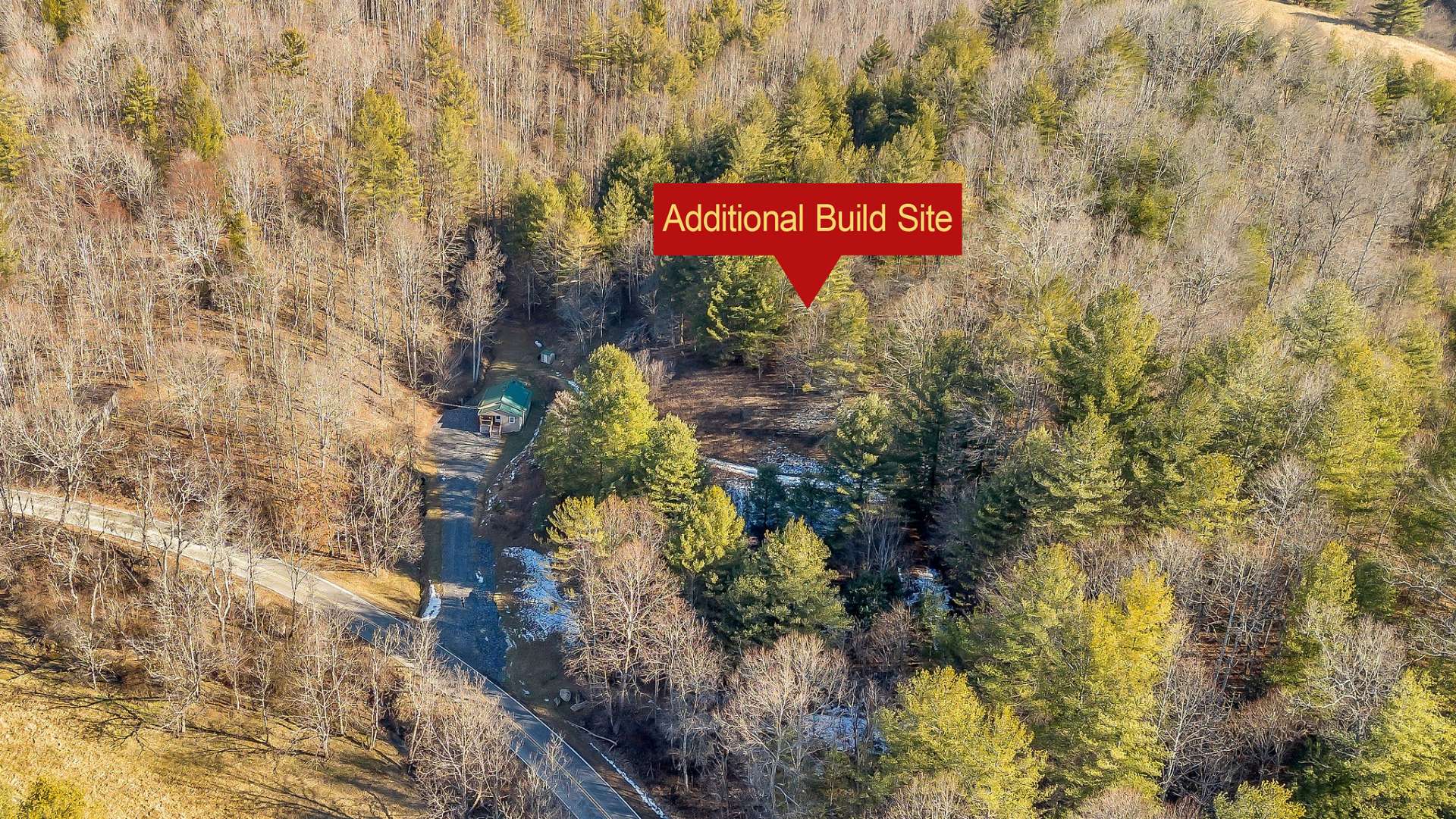 Enjoy the land now while planning your forever home on the flat homesite up the hill.