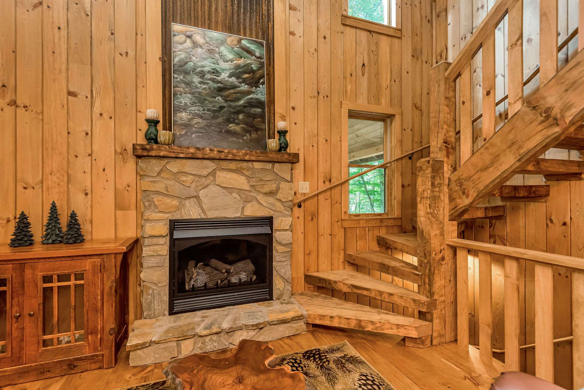 The stone fireplace is perfect for cozying up to on cool fall or winter days.