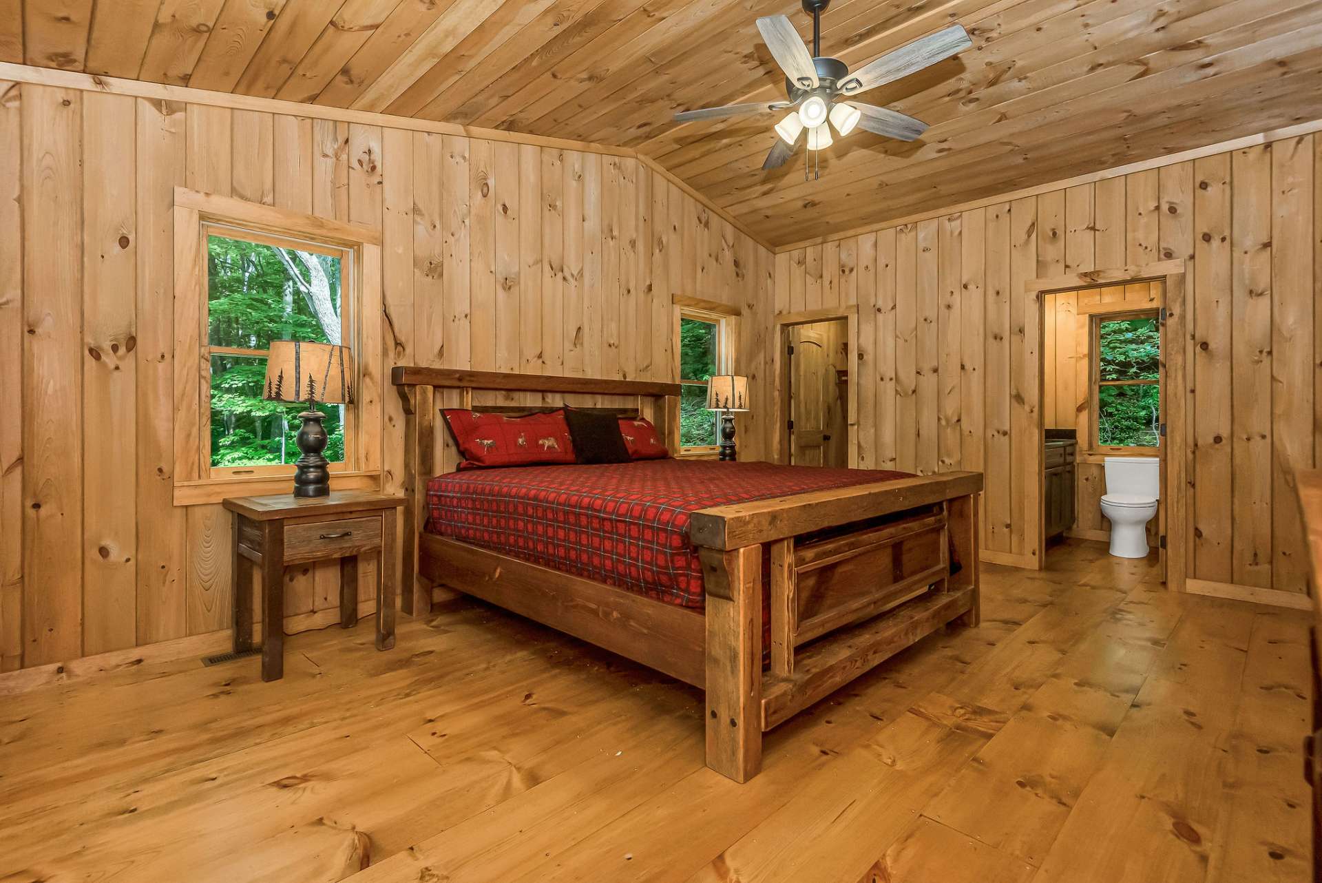 As you enter, you'll find the continuation of the wide plank pine flooring and the inviting warmth of tongue-and-groove walls and ceiling, creating a cozy and rustic ambiance.