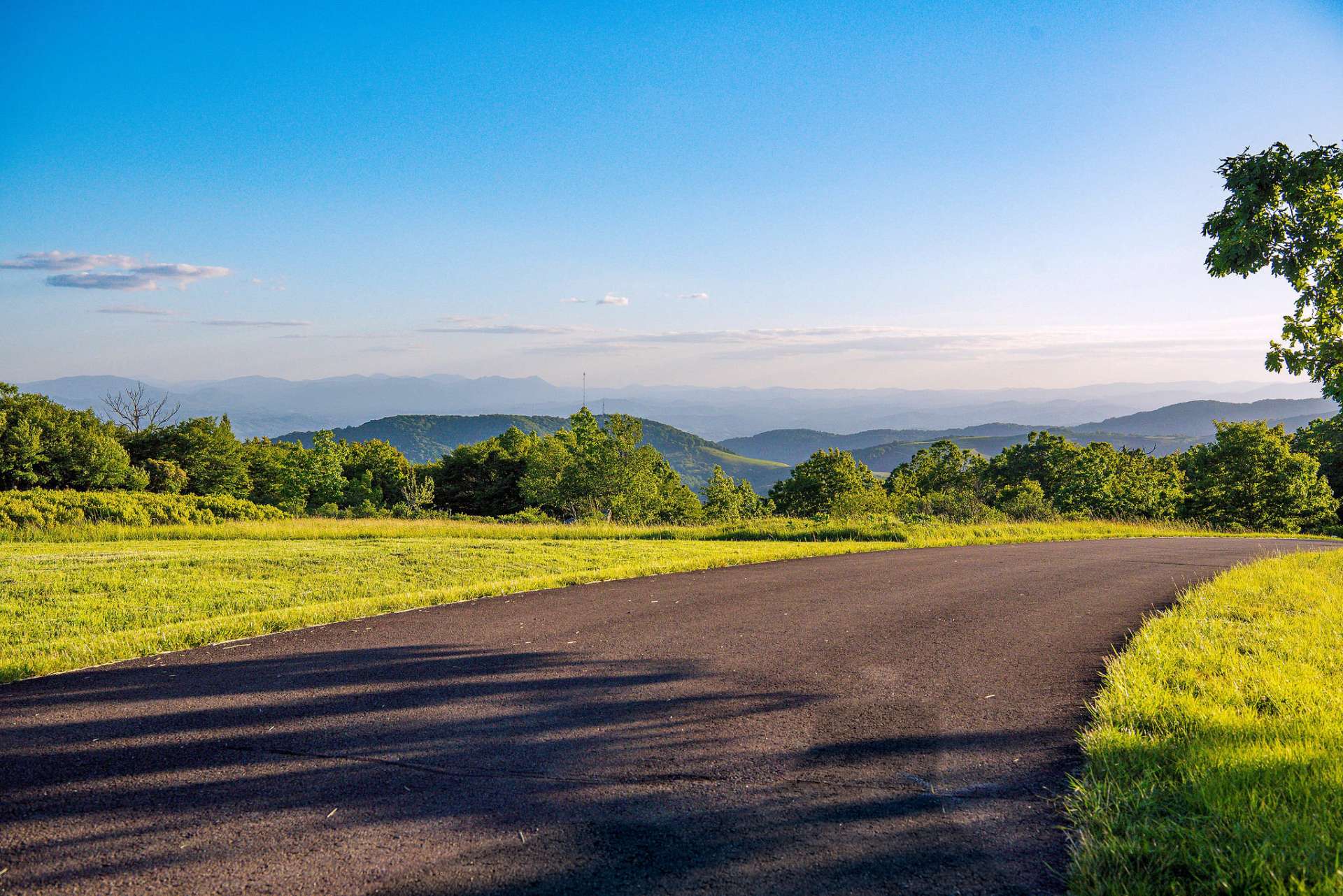 Private paved road, canopied with native hardwoods and opening up to breathtaking views.