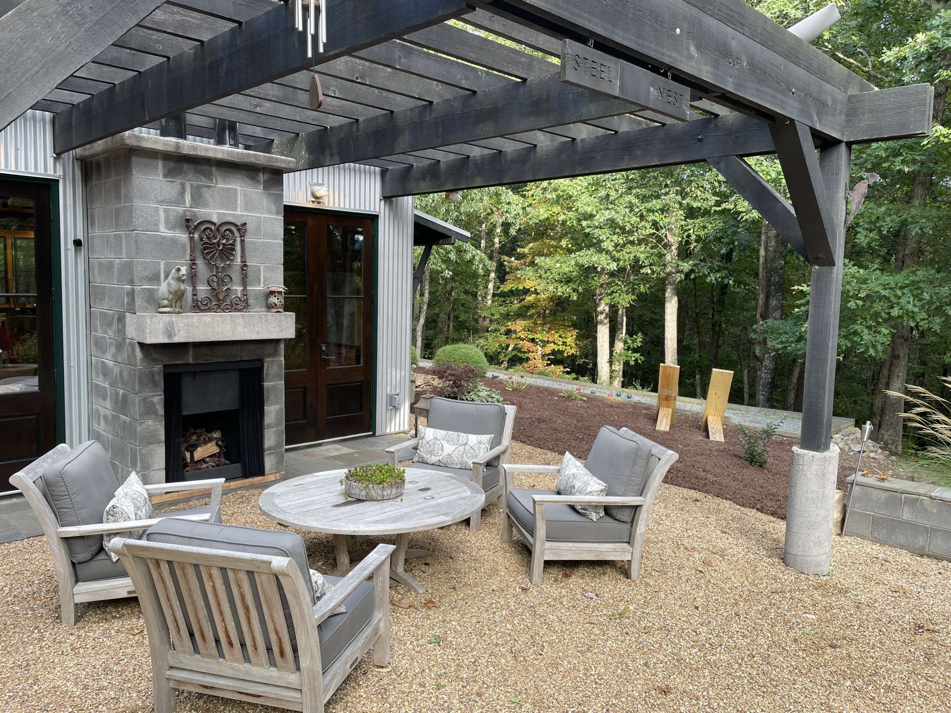 Outdoor seating area with fireplace.