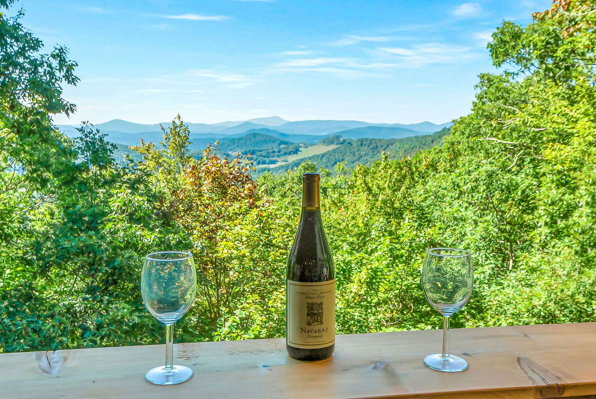 Wine down your day with panoramic mountain vistas from the porch's bar top.