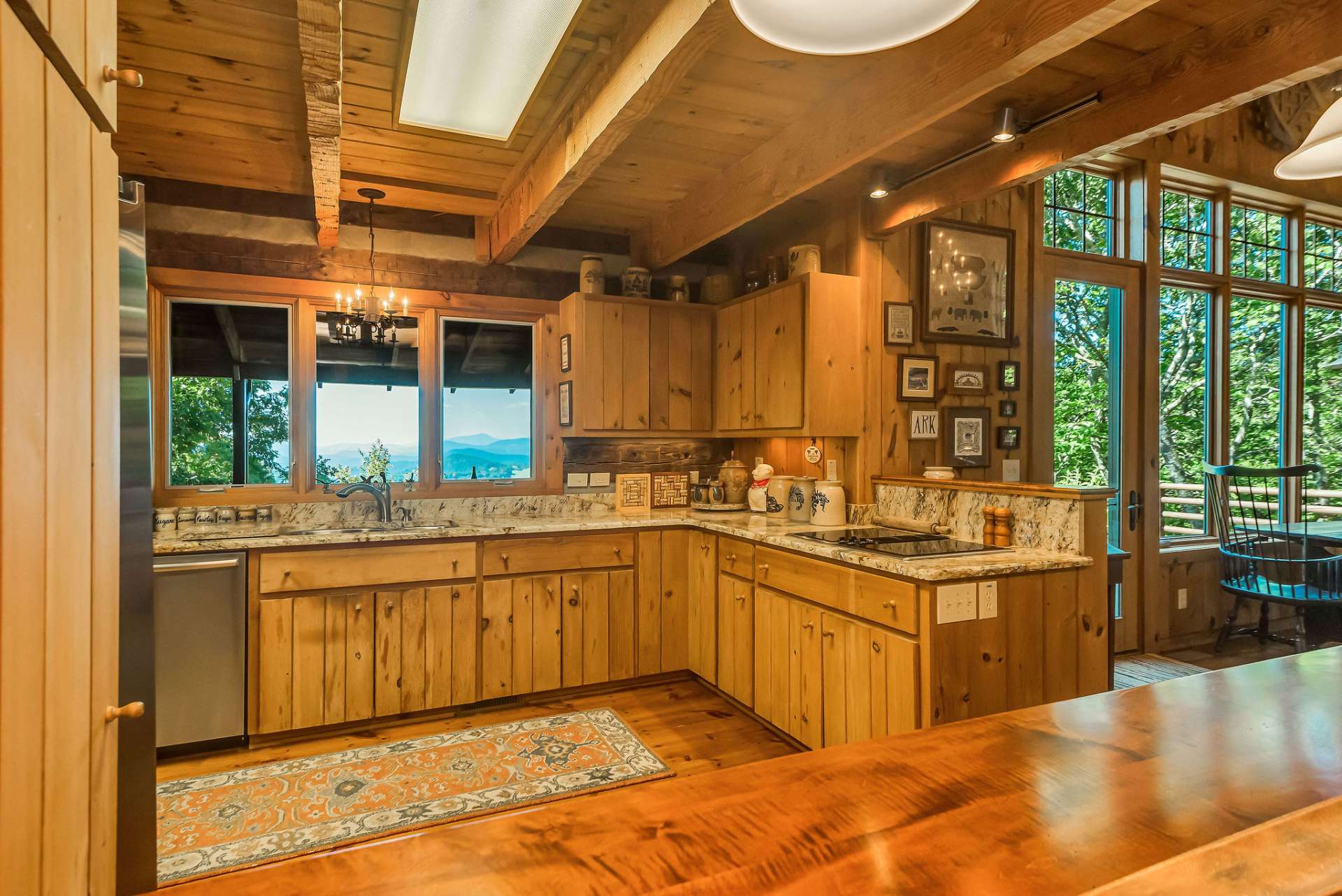 The kitchen creates a scenic work space with granite countertops, stainless appliances and an electric cooktop that comes with canning, grill and other accessories.