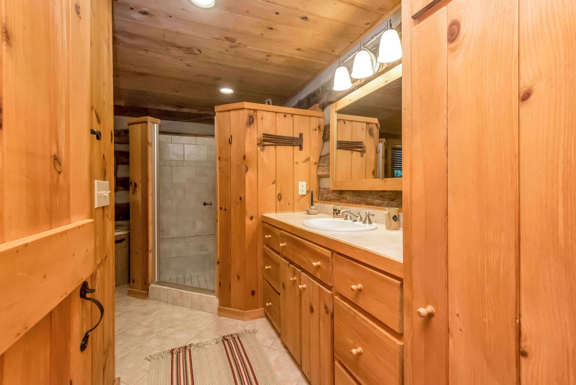 The primary bath boasts a generously sized walk-in shower.