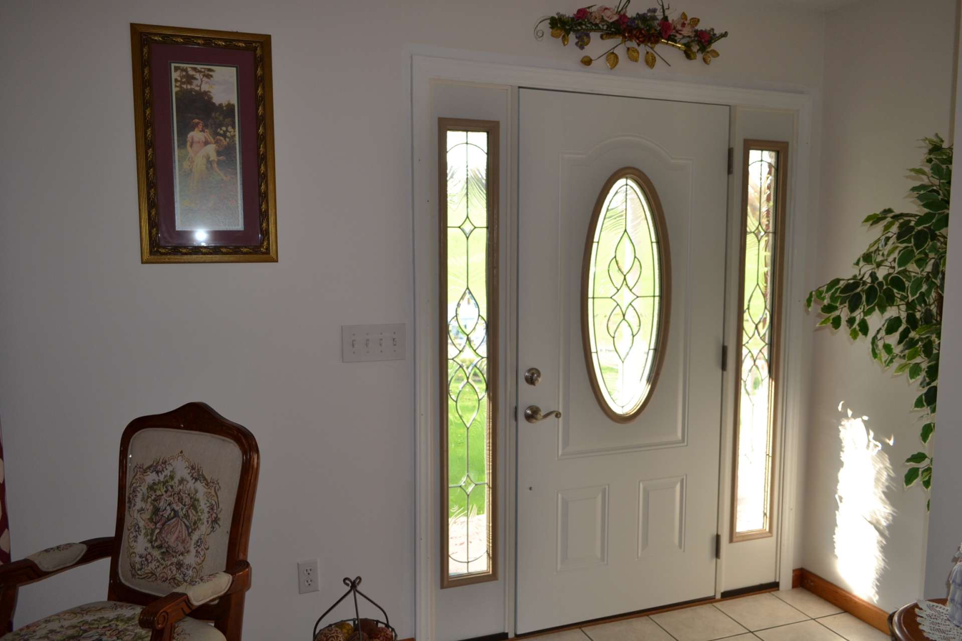 This home welcomes you and guests with lots of custom details such as this front door with beveled glass.