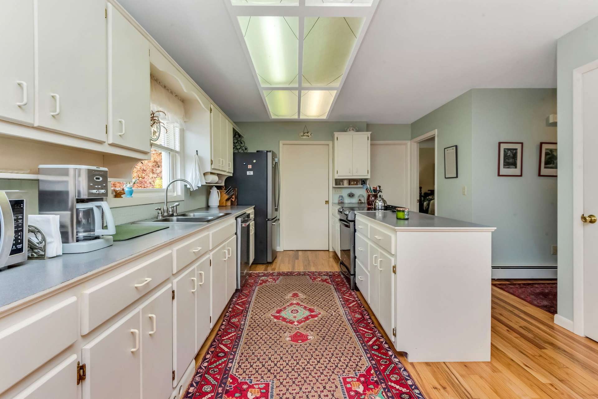 The kitchen offers plenty of work and storage space.