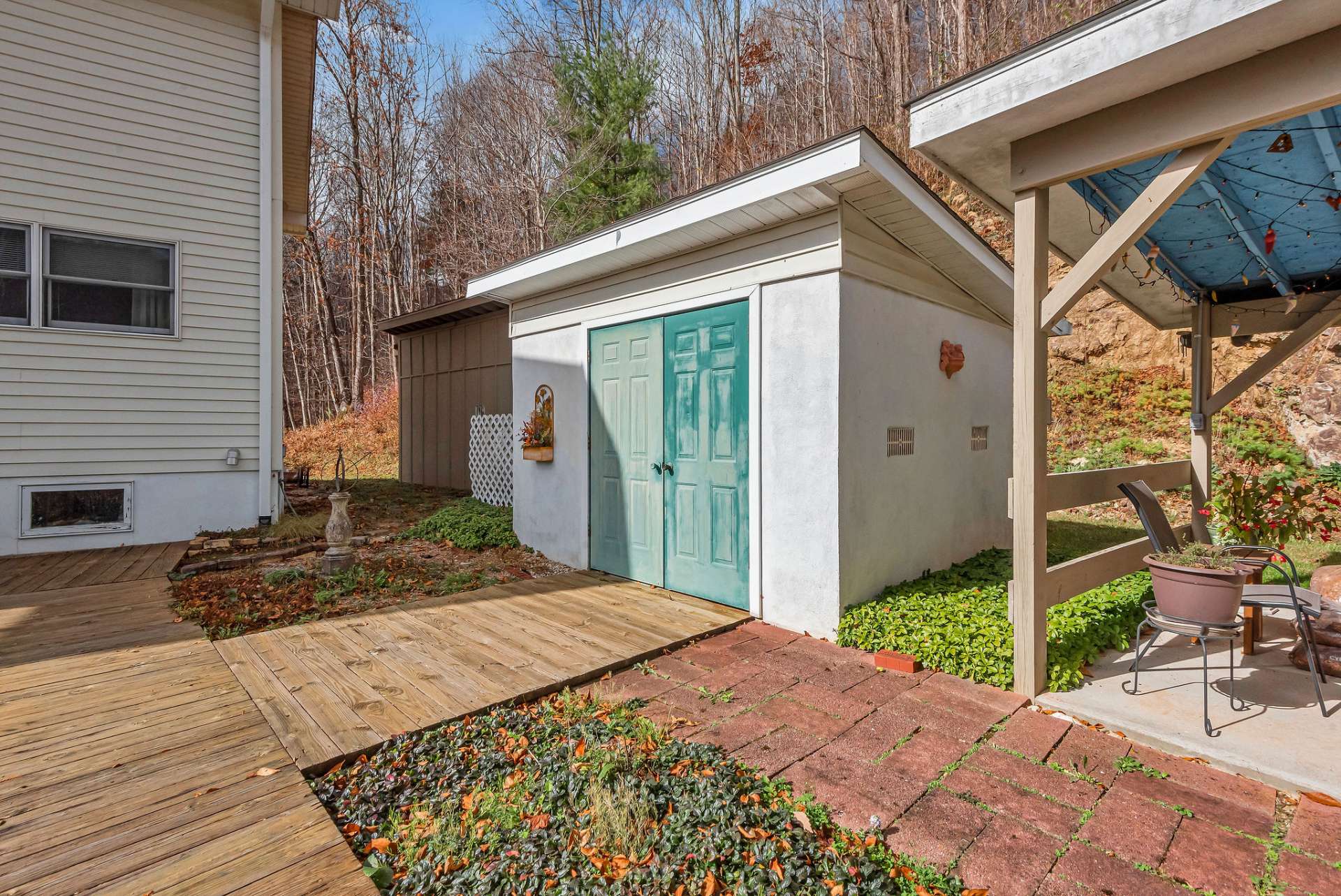 There are two outbuildings for storing your equipment or mountain toys. Or, create a potting shed for landscaping projects.