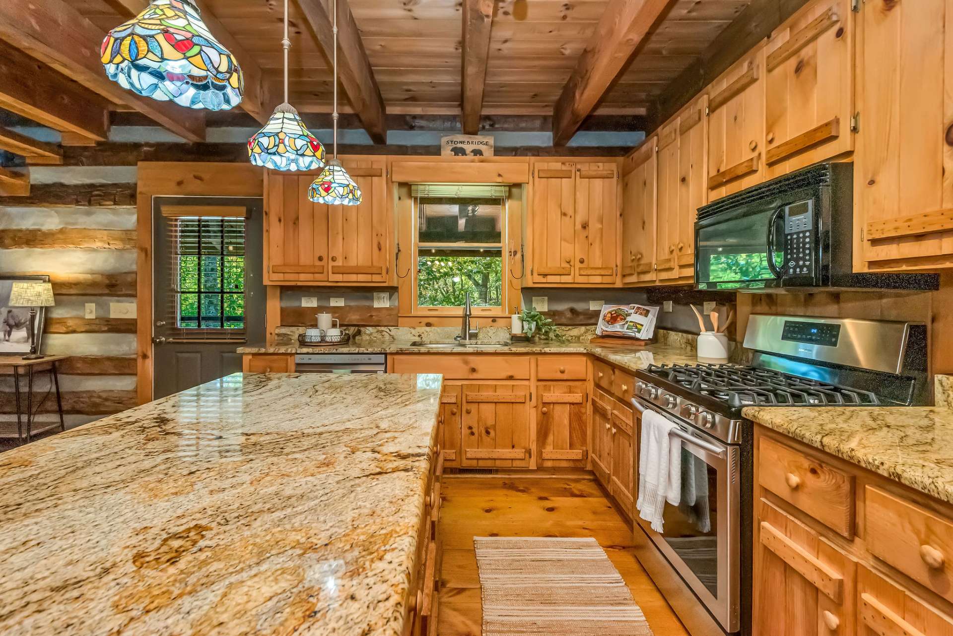 This kitchen is a chef's dream, offering plenty of prep space and abundant storage for all your culinary needs.