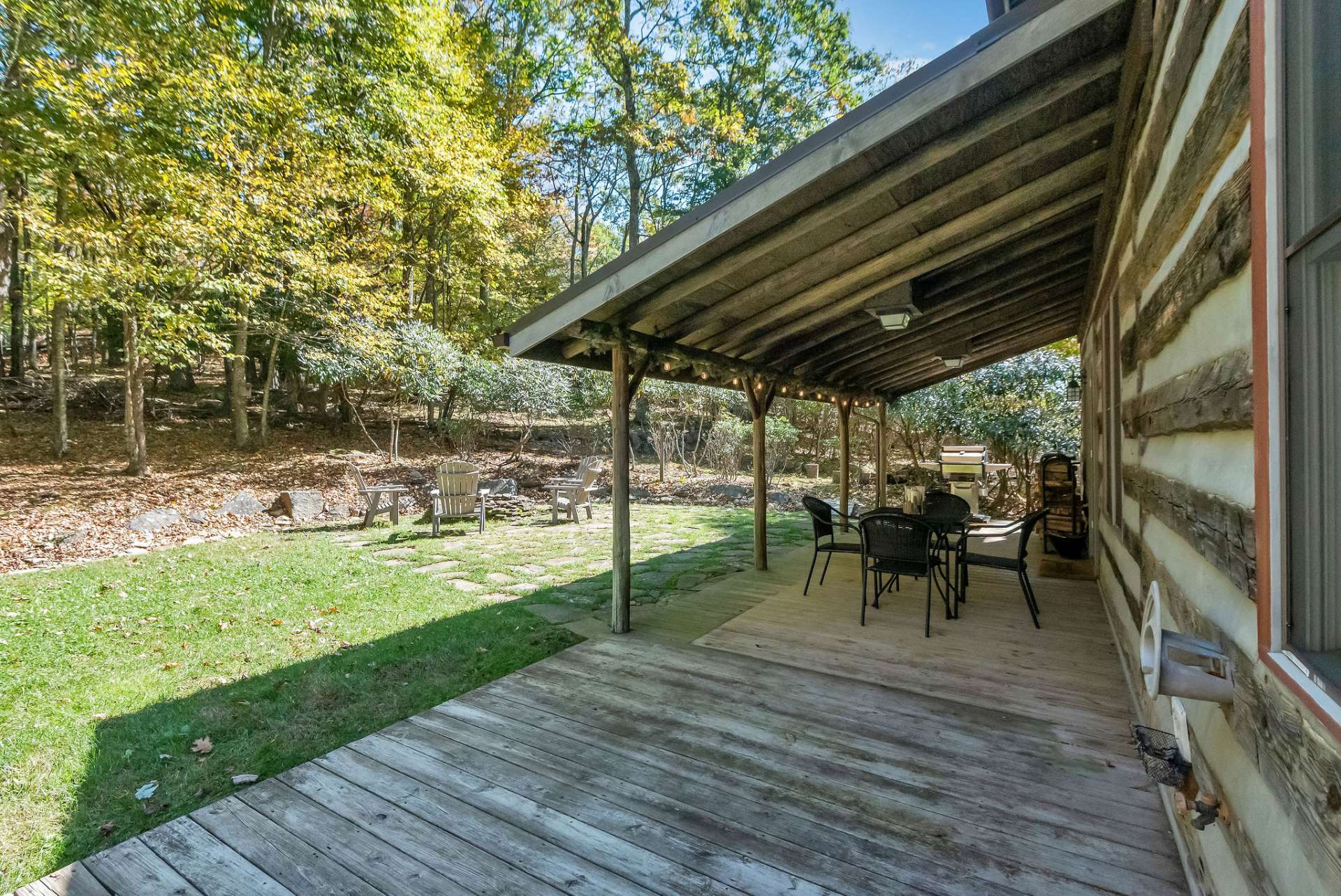 The great room conveniently connects the expansive outdoor patio, allowing guests to easily mingle between the indoor and outdoor areas, savoring the charm of every space this home has to offer.