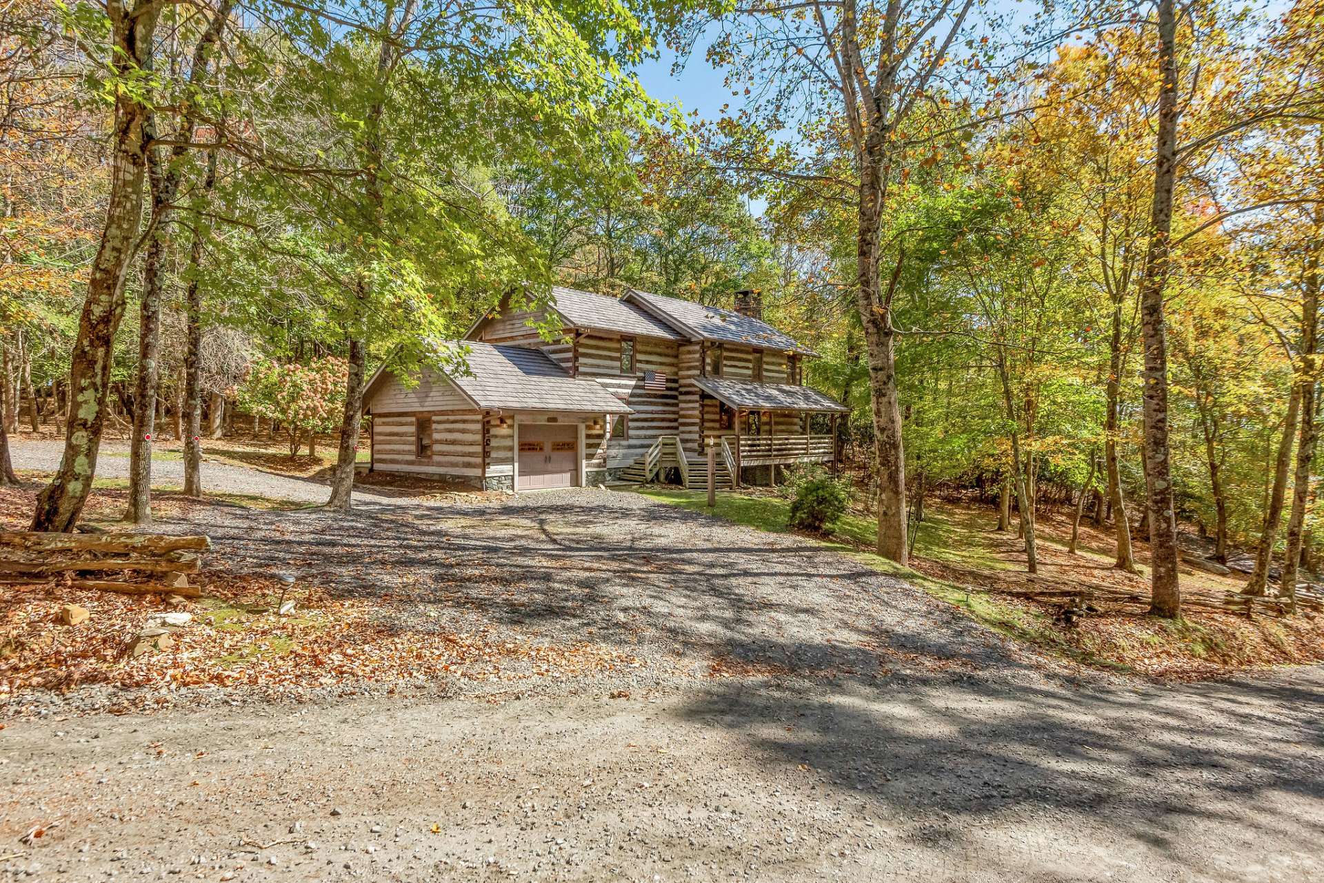 Embrace serene mountain living with easy access to the towns of West Jefferson and Boone from your antique log home located in the charming neighborhood of Stonebridge.