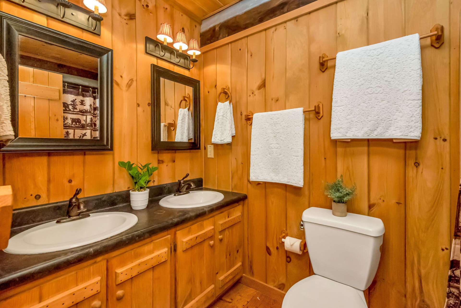 This ensuite bath offers double sinks and a shower combined with a relaxing tub.