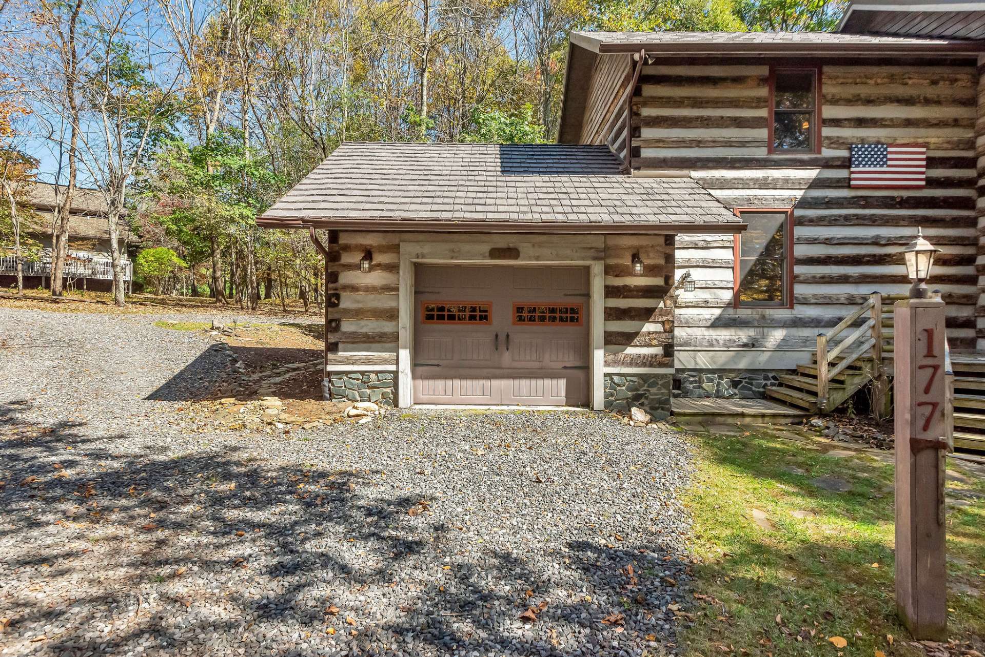 This garage offers plenty of space for both a car and a dedicated workshop area.